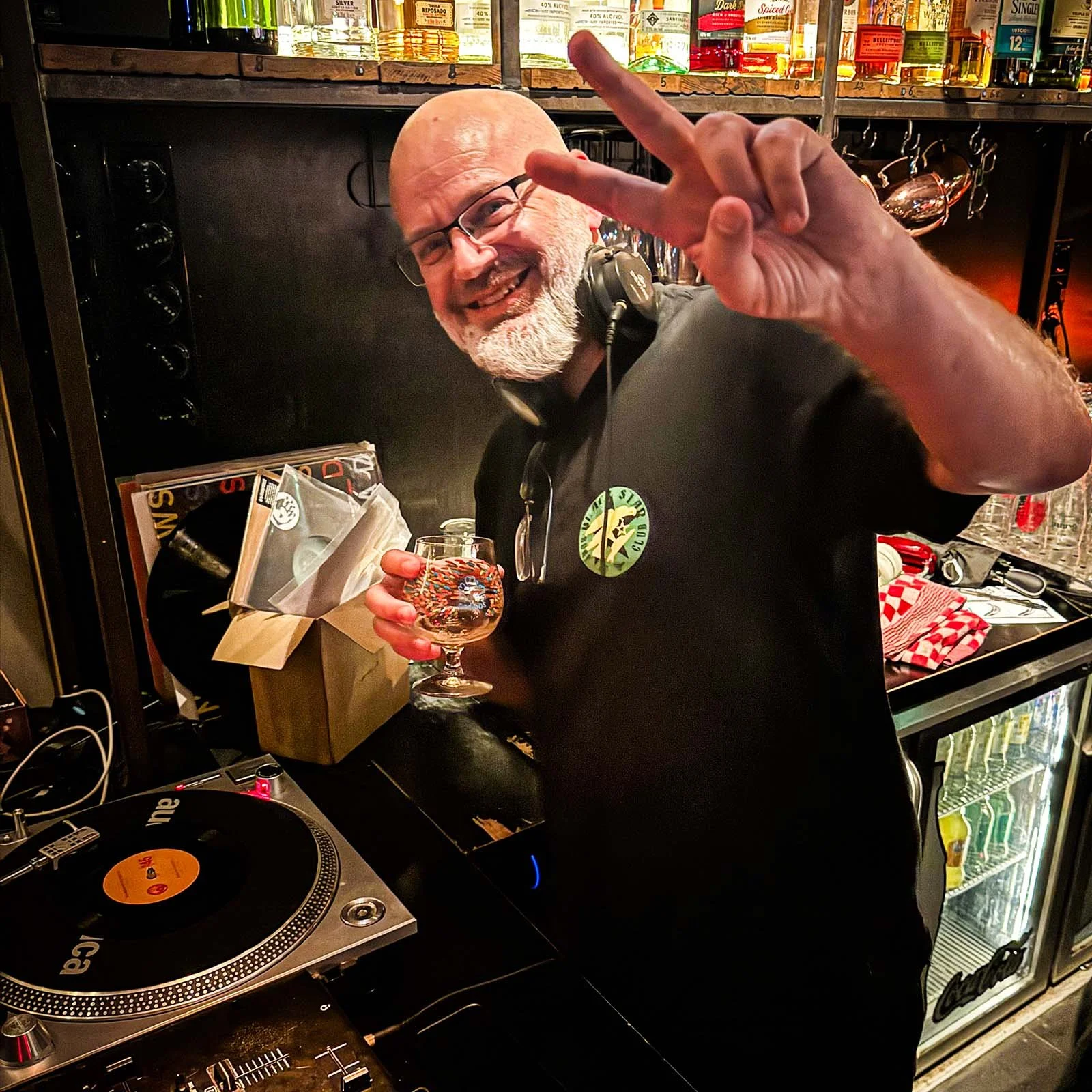 DJ Fresh Fruit at the turntables playing a guest DJ set at Amsterdam Vinyl Club, a live music community event.
