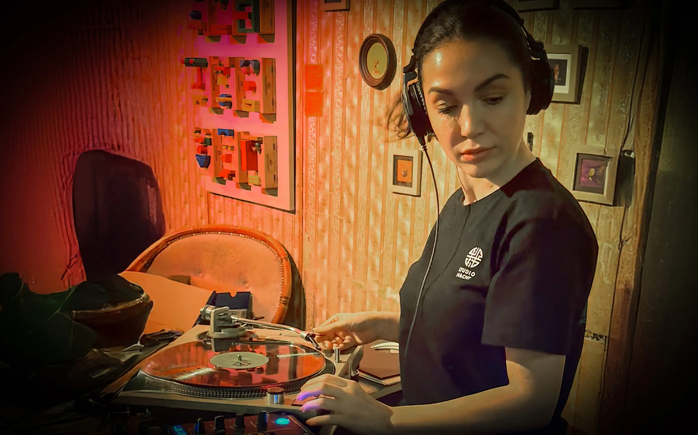 Sophia Sigma at the turntables playing a guest DJ set at Amsterdam Vinyl Club, a live music community event.
