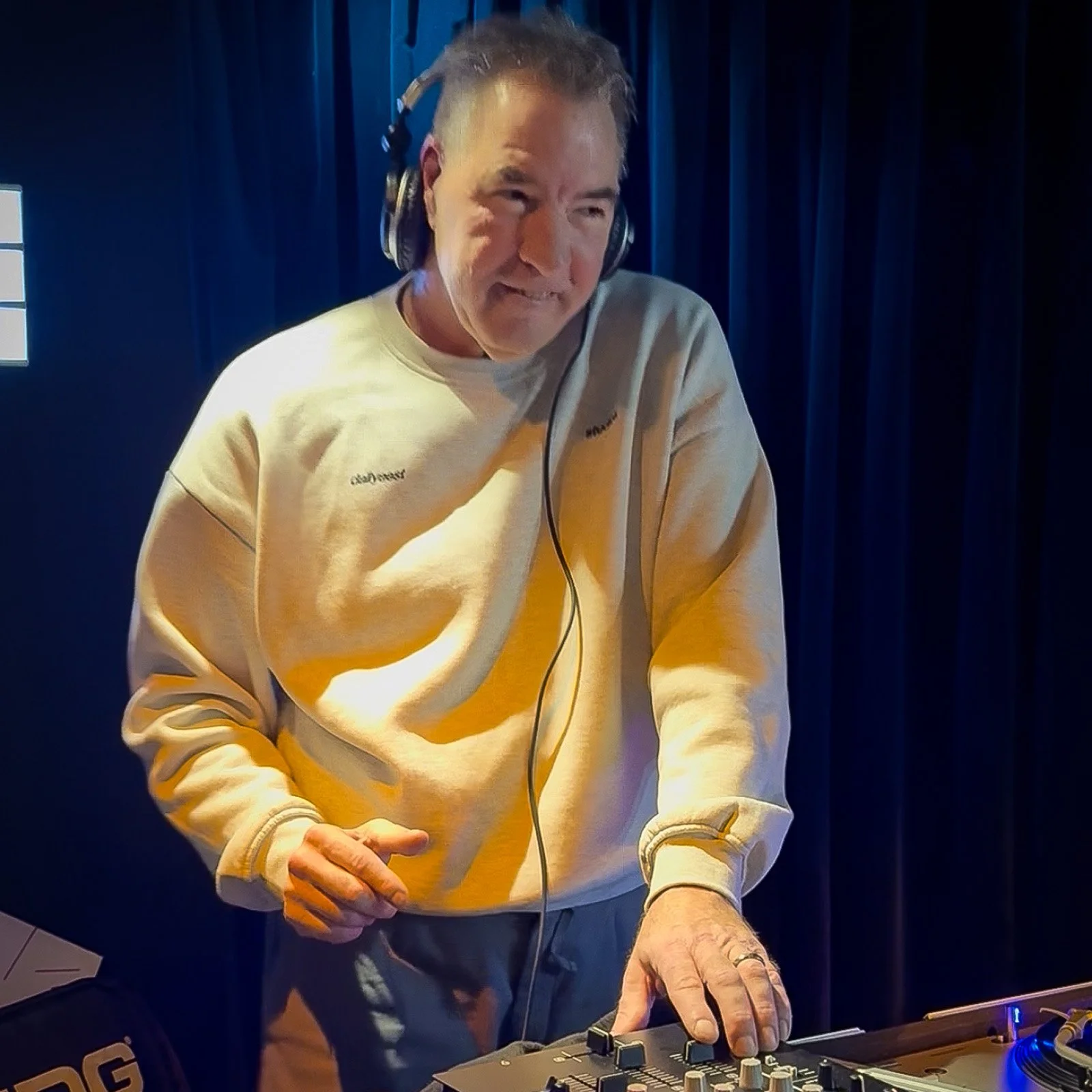 DJ Jaimy at the turntables playing a guest DJ set at Amsterdam Vinyl Club, a live music community event.