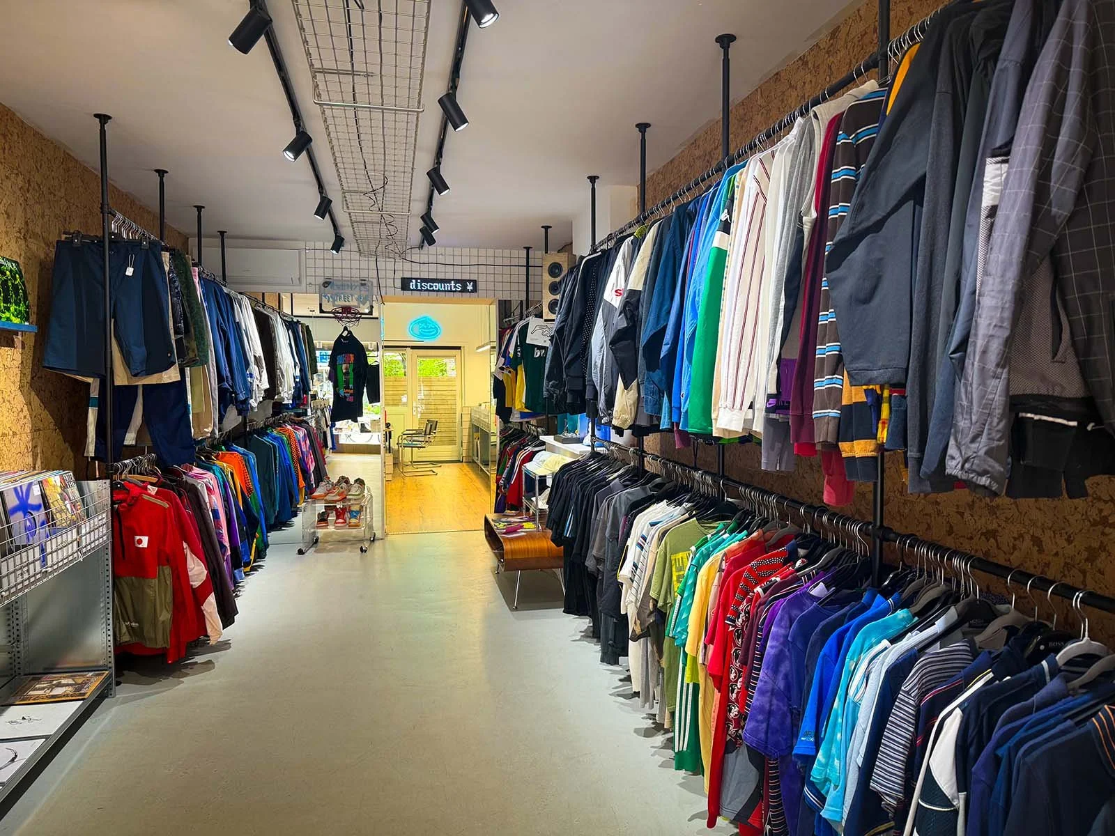 The interior of GOT.DRIP Streetwear and Records, a vinyl and clothing store in Amsterdam, Netherlands. There are hundreds of vinyl records on display.