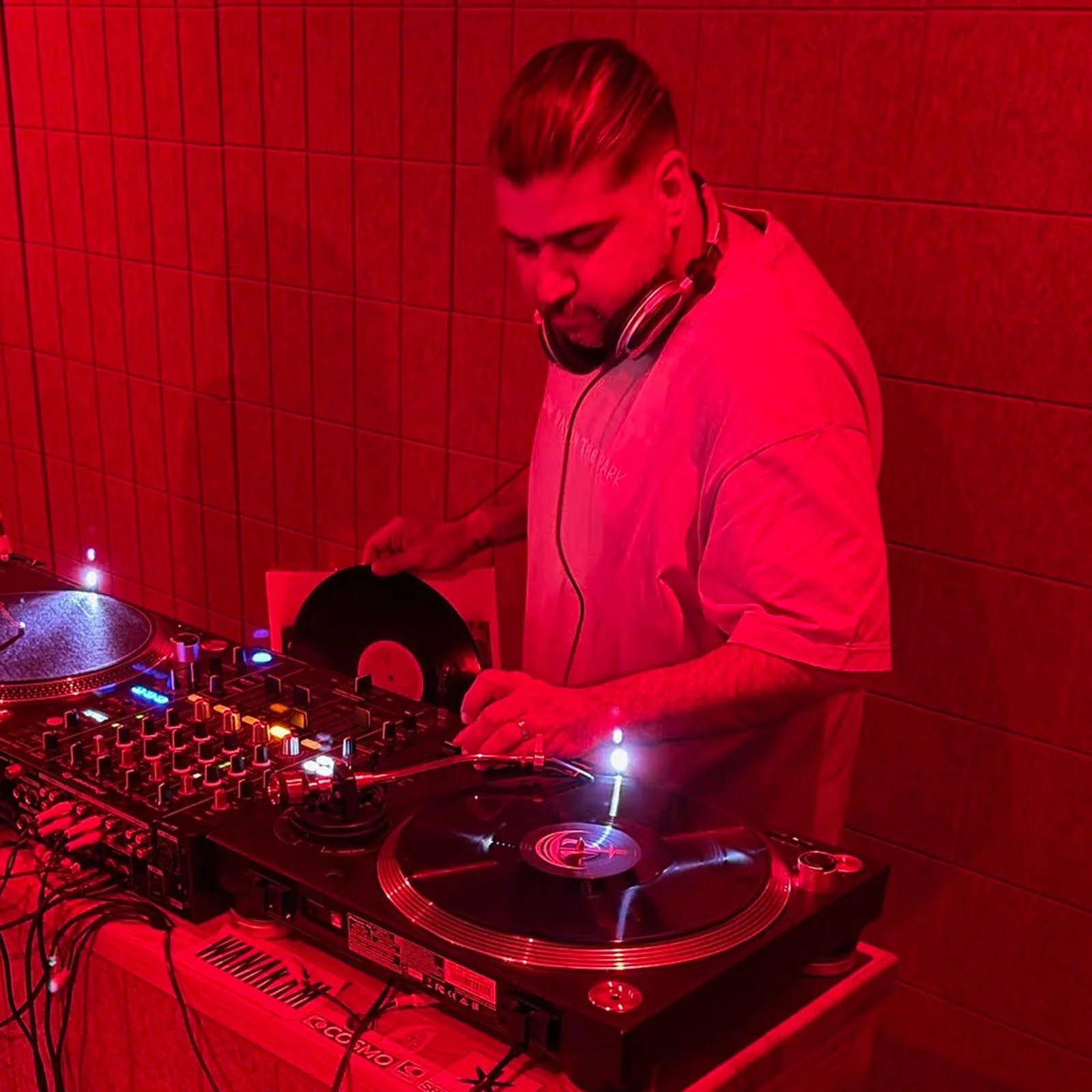 Deepak Nichani at the turntables playing a guest DJ set at Amsterdam Vinyl Club, a live music community event.