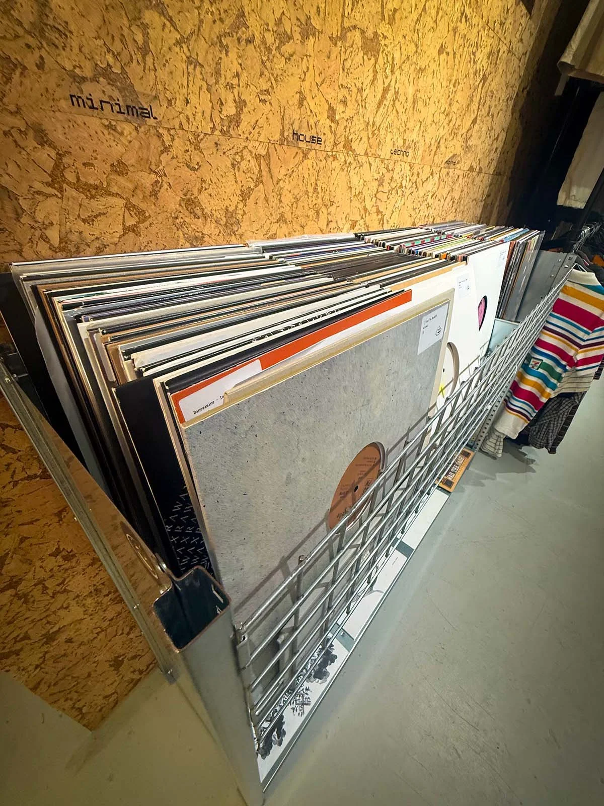 The interior of GOT.DRIP Streetwear and Records, a vinyl and clothing store in Amsterdam, Netherlands. There are hundreds of vinyl records on display.