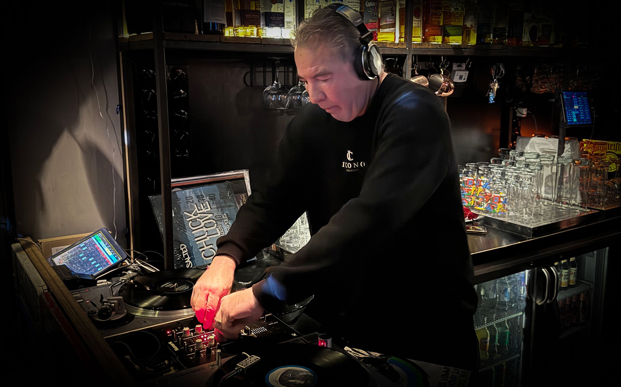 DJ Jaimy at the turntables playing a guest DJ set at Amsterdam Vinyl Club, a live music community event.