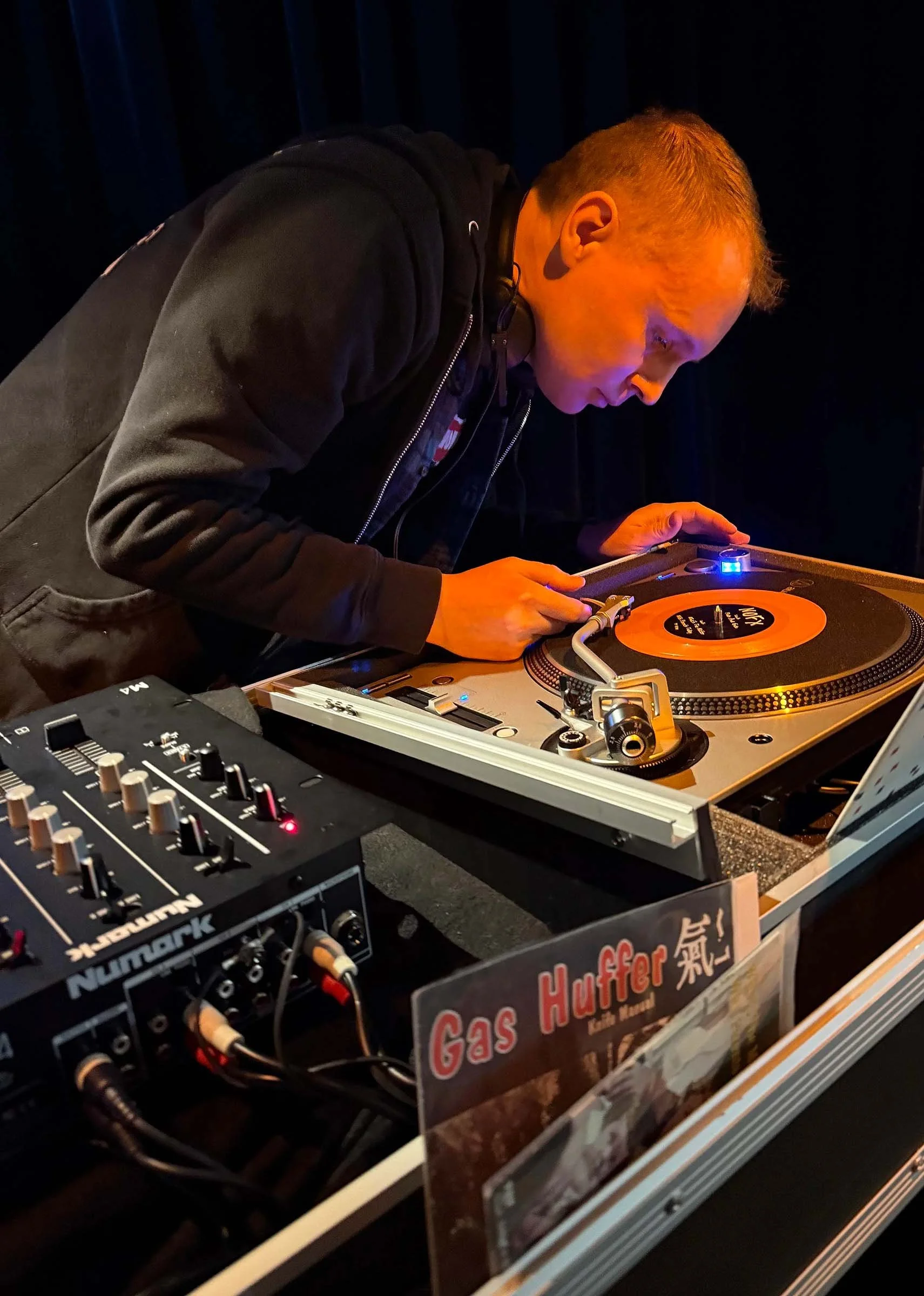 DJ Cherry Cola at the turntables playing a guest DJ set at Amsterdam Vinyl Club, a live music community event.