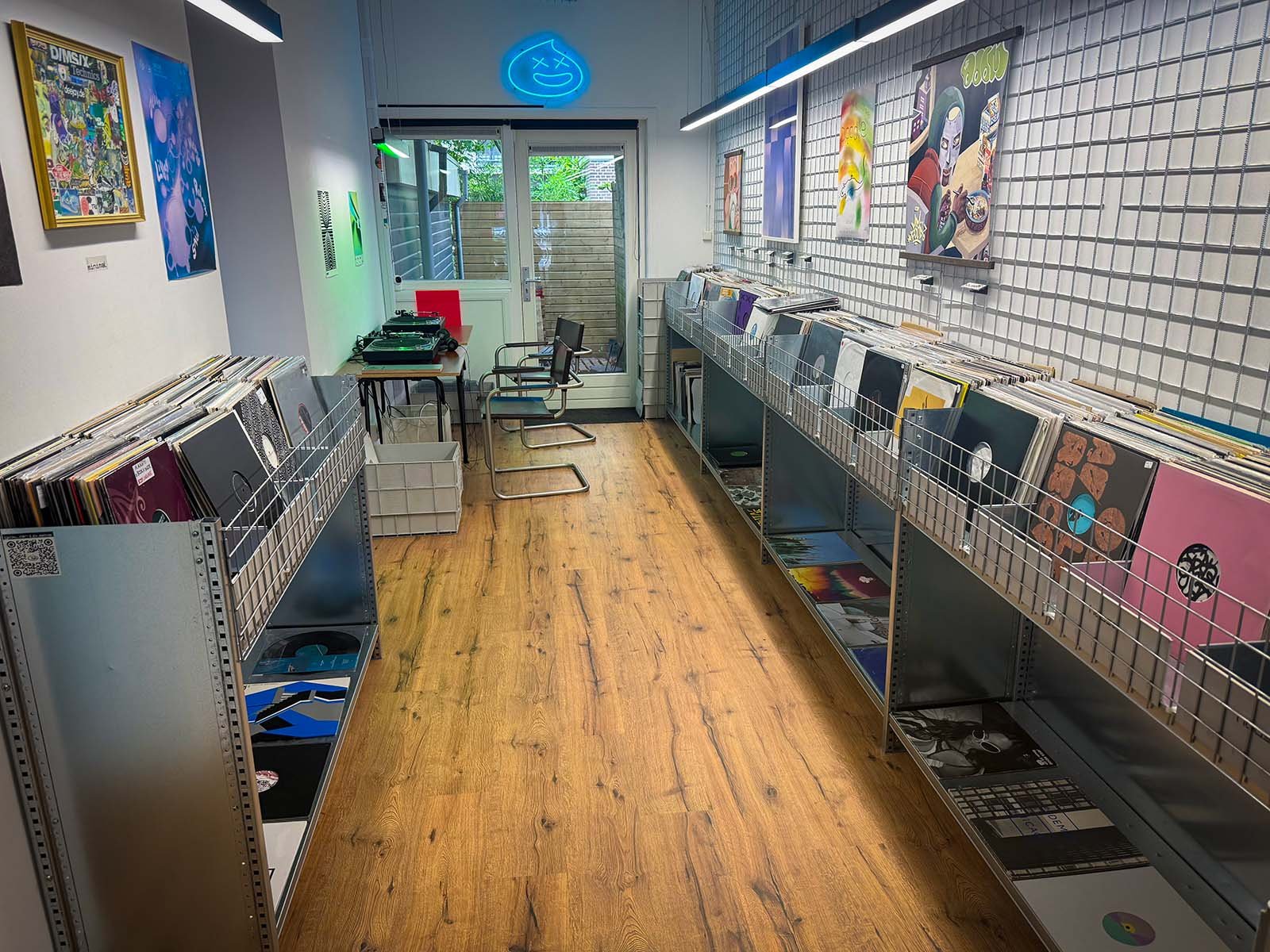 The interior of GOT.DRIP Streetwear and Records, a vinyl and clothing store in Amsterdam, Netherlands. There are hundreds of vinyl records on display.