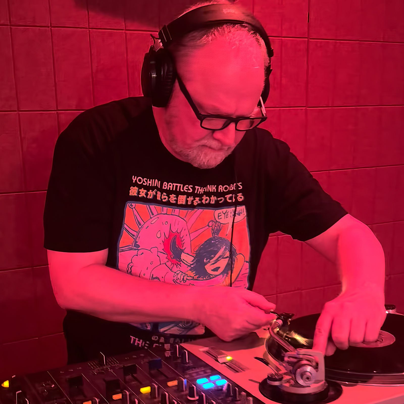 DJ Roland at the turntables playing a guest DJ set at Amsterdam Vinyl Club, a live music community event.