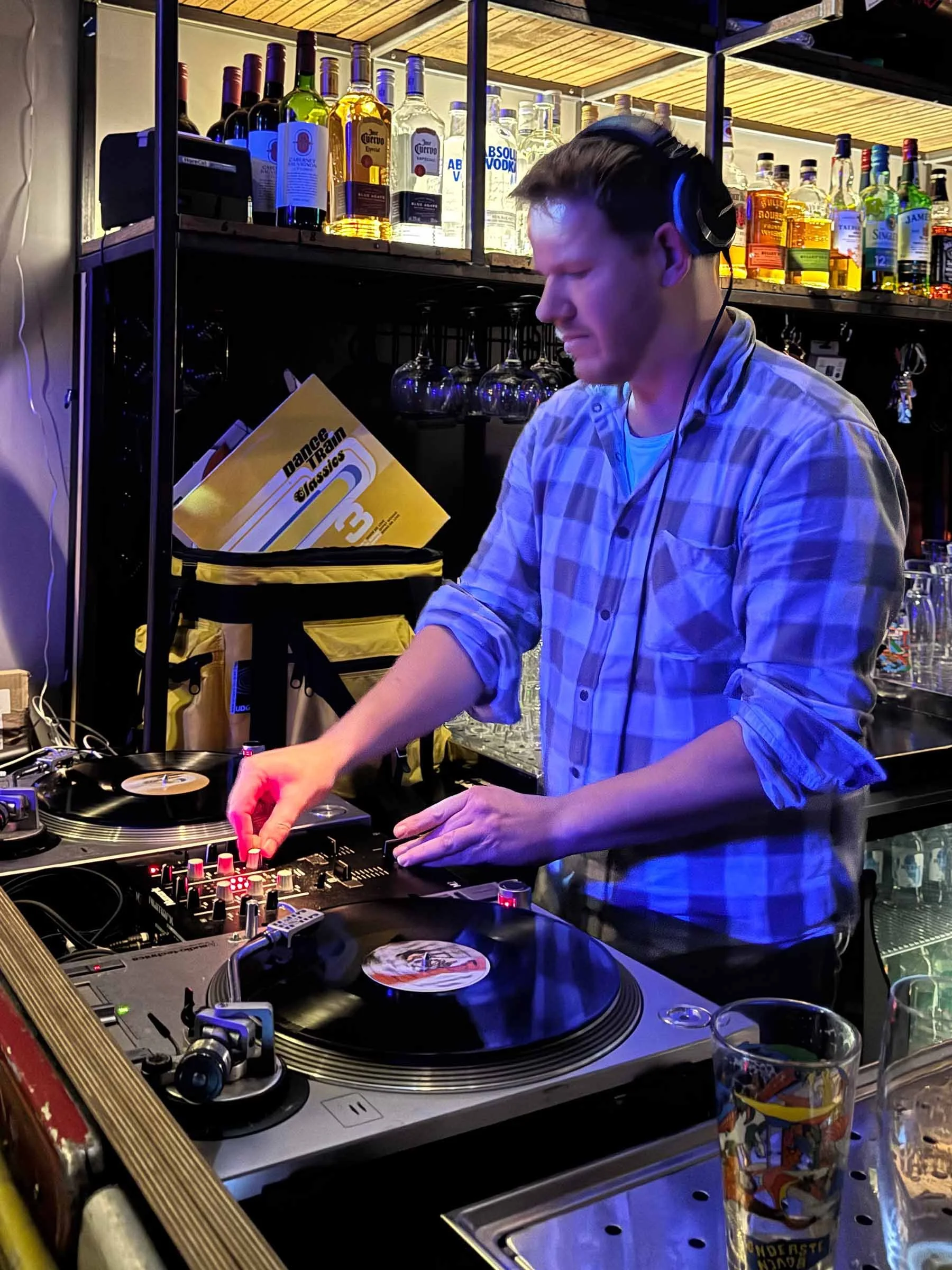 Walter Vooys at the turntables playing a guest DJ set at Amsterdam Vinyl Club, a live music community event.