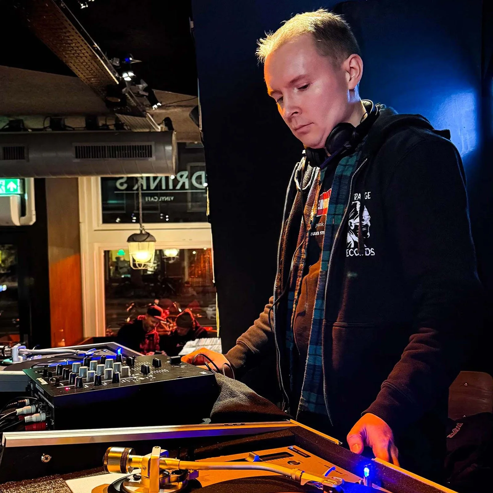 DJ Cherry Cola at the turntables playing a guest DJ set at Amsterdam Vinyl Club, a live music community event.