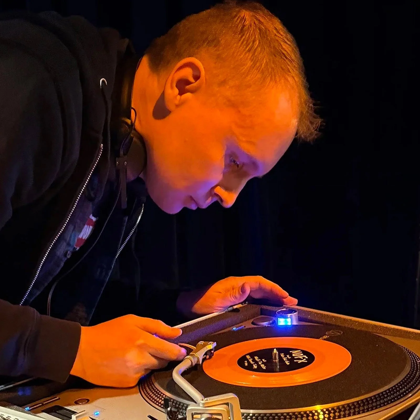 DJ Cherry Cola at the turntables playing a guest DJ set at Amsterdam Vinyl Club, a live music community event.