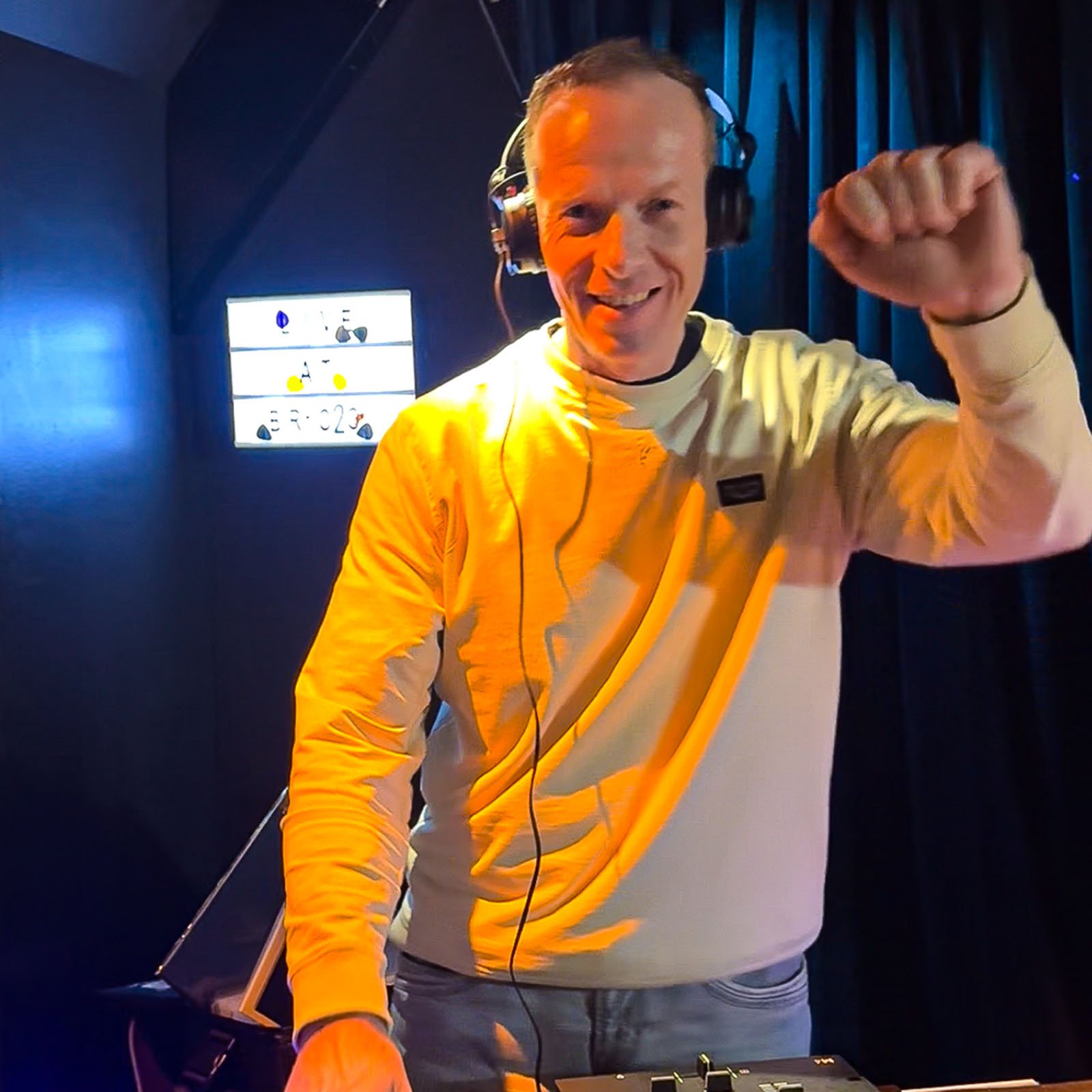 DJ Miro at the turntables playing a guest DJ set at Amsterdam Vinyl Club, a live music community event.