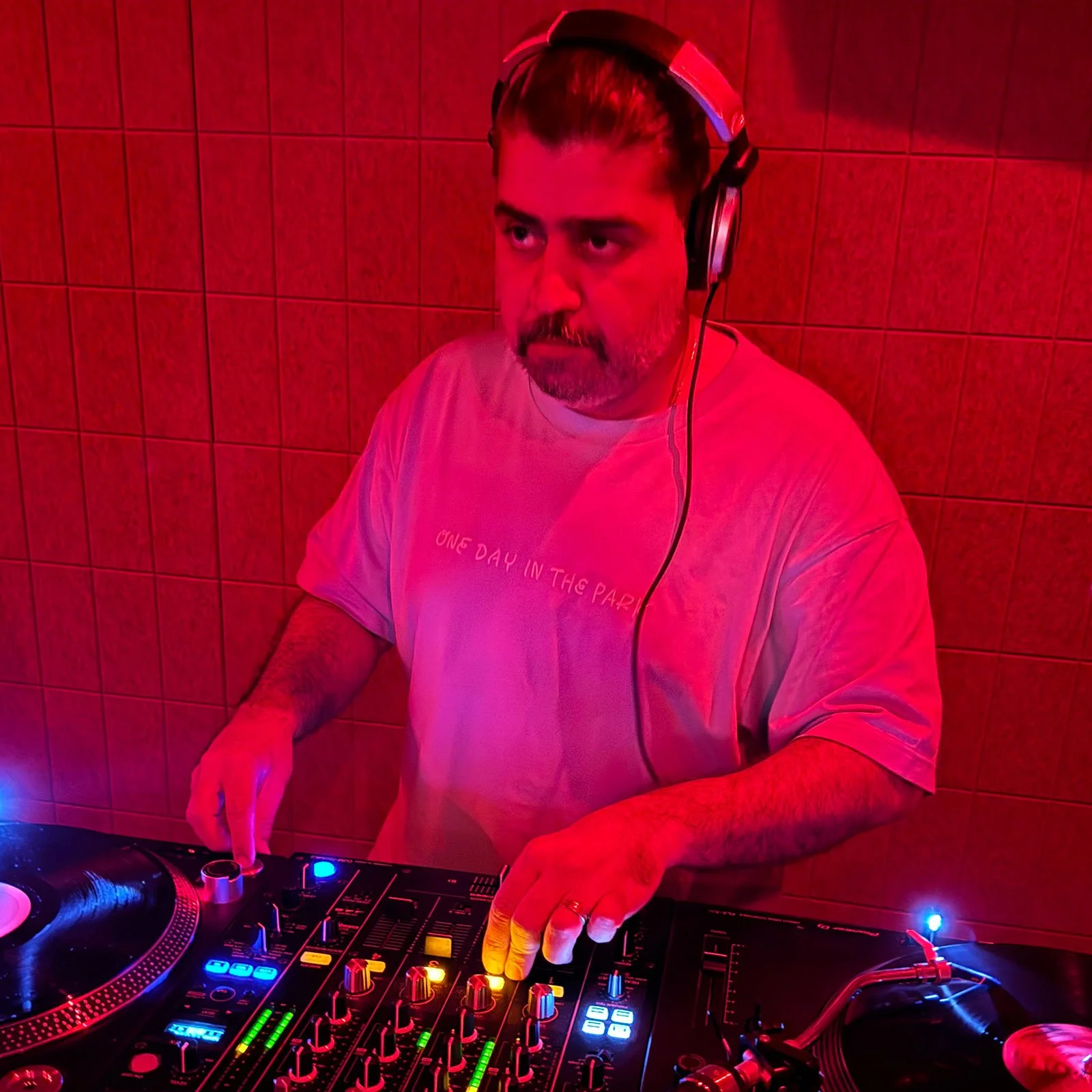 Deepak Nichani at the turntables playing a guest DJ set at Amsterdam Vinyl Club, a live music community event.