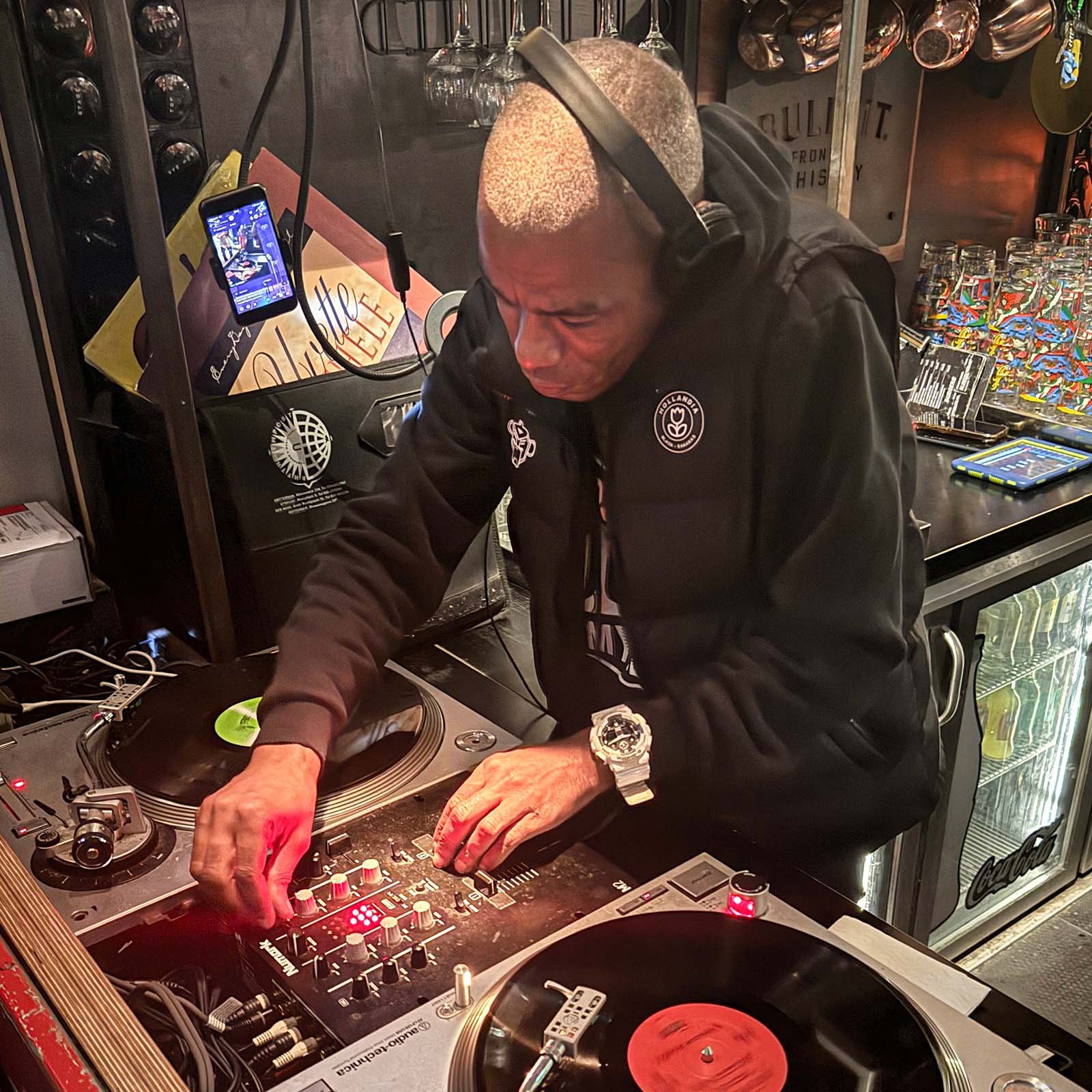 DJ Fresh at the turntables playing a guest DJ set at Amsterdam Vinyl Club, a live music community event.
