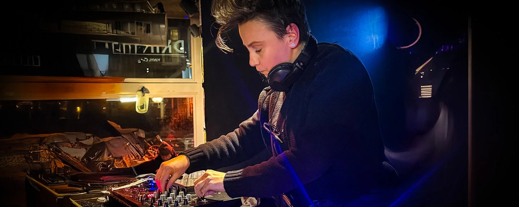 Nympho at the turntables playing a guest DJ set at Amsterdam Vinyl Club, a live music community event.