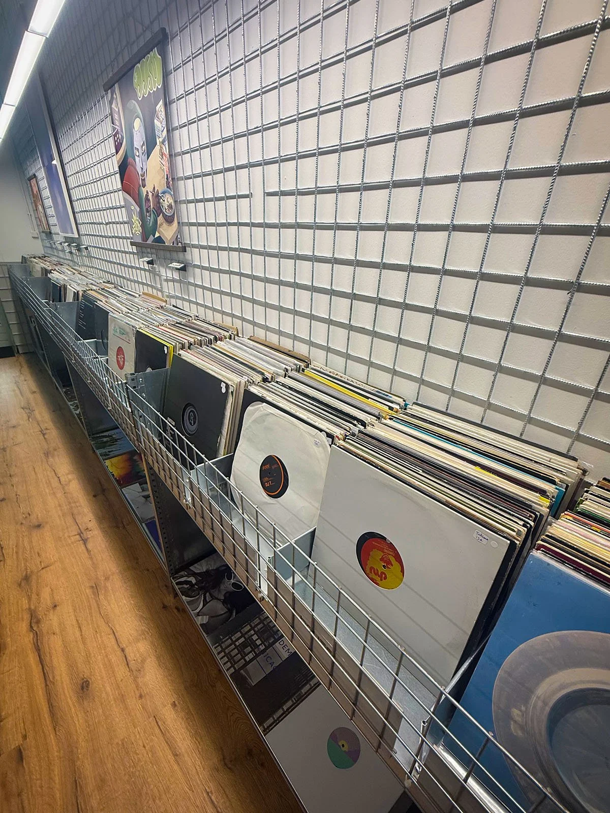 The interior of GOT.DRIP Streetwear and Records, a vinyl and clothing store in Amsterdam, Netherlands. There are hundreds of vinyl records on display.
