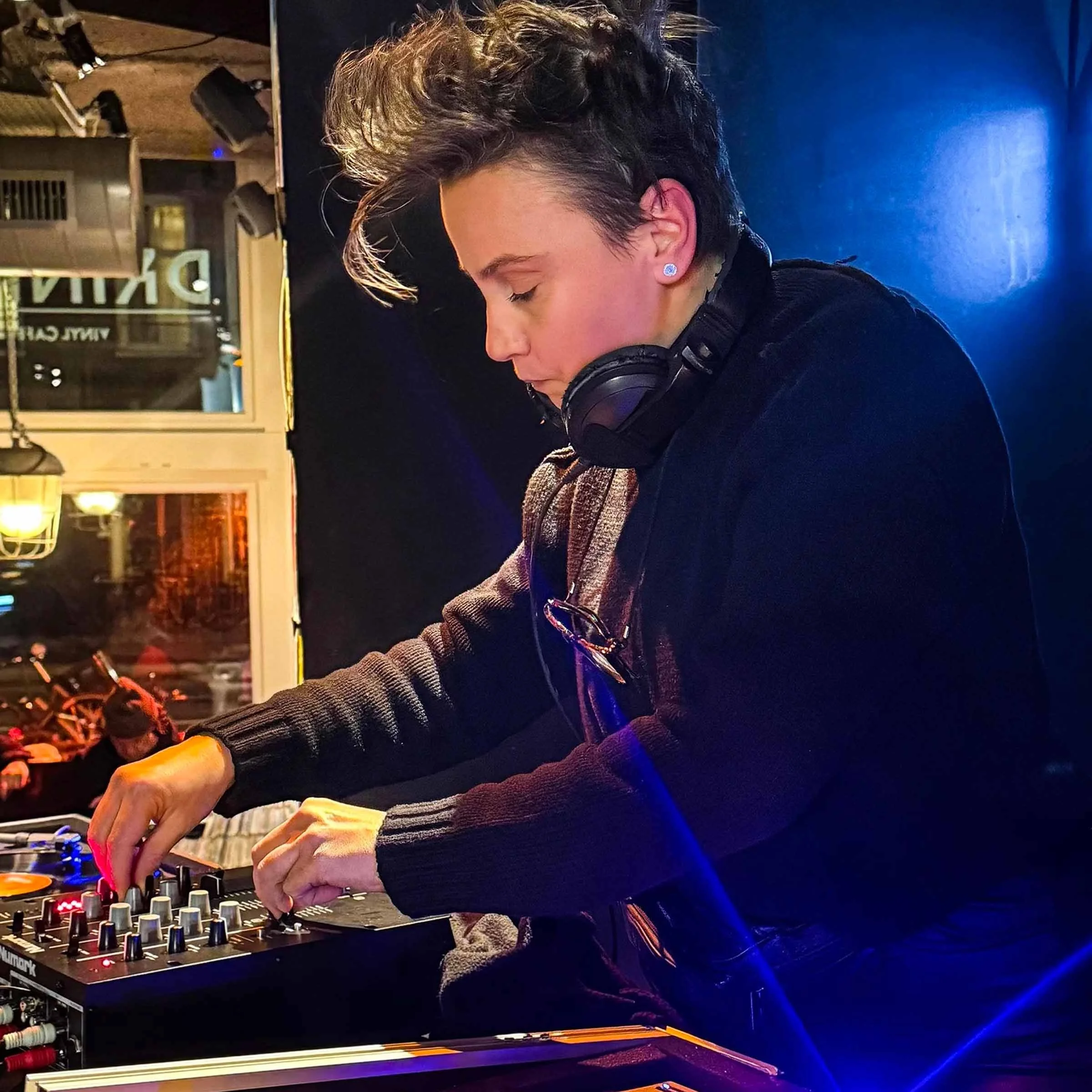 Nympho at the turntables playing a guest DJ set at Amsterdam Vinyl Club, a live music community event.