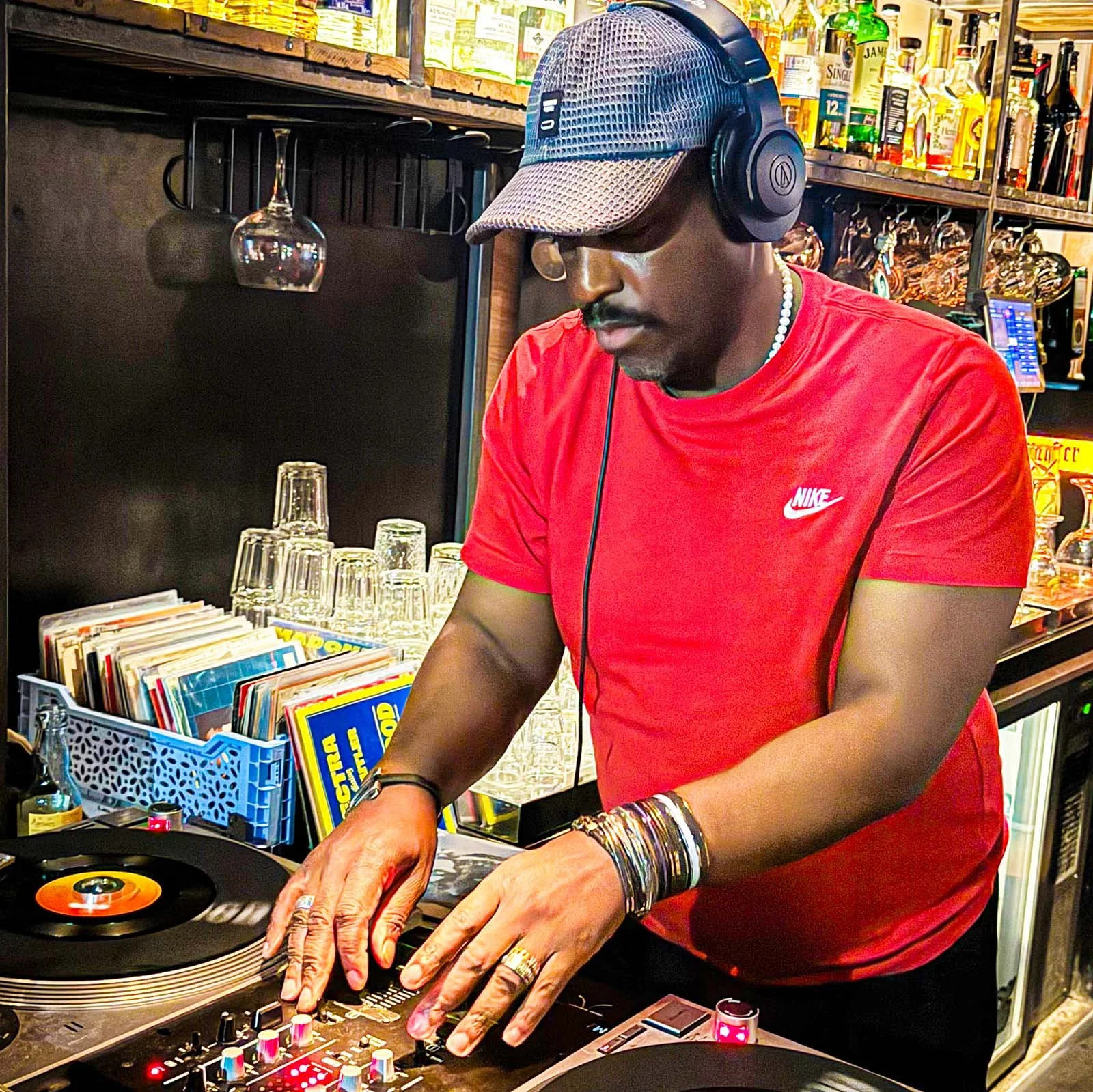 DJ Tea & 2 Sugars at the turntables playing a guest DJ set at Amsterdam Vinyl Club, a live music community event.
