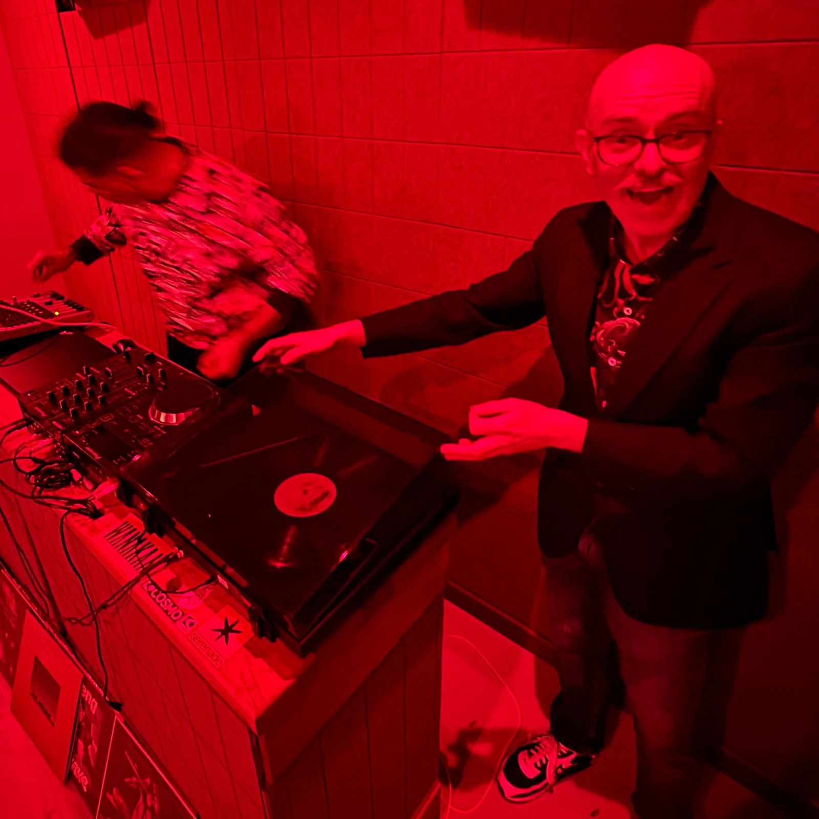 Deepak Nichani at the turntables playing a guest DJ set at Amsterdam Vinyl Club, a live music community event.