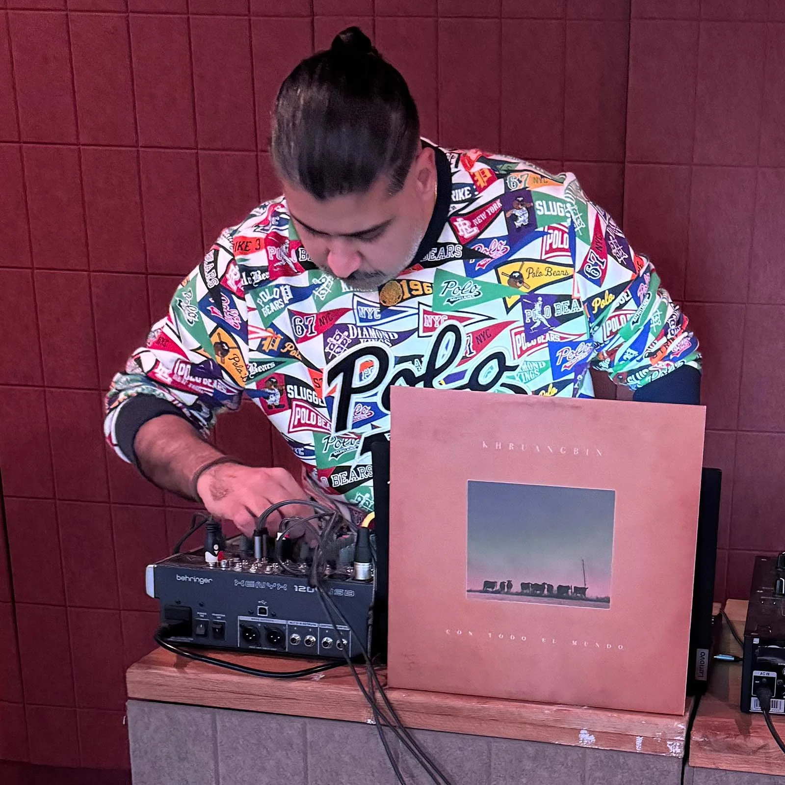 Deepak Nichani at the turntables playing a guest DJ set at Amsterdam Vinyl Club, a live music community event.