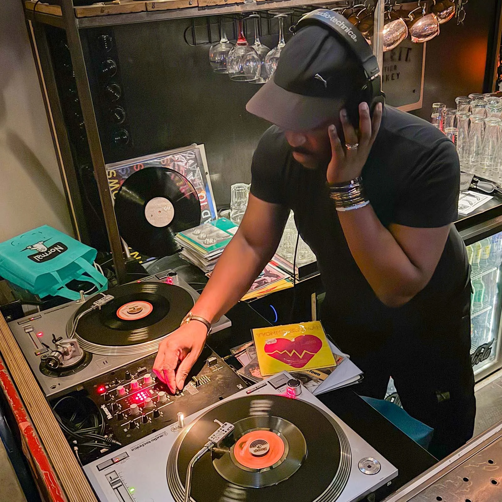 DJ Tea & 2 Sugars at the turntables playing a guest DJ set at Amsterdam Vinyl Club, a live music community event.
