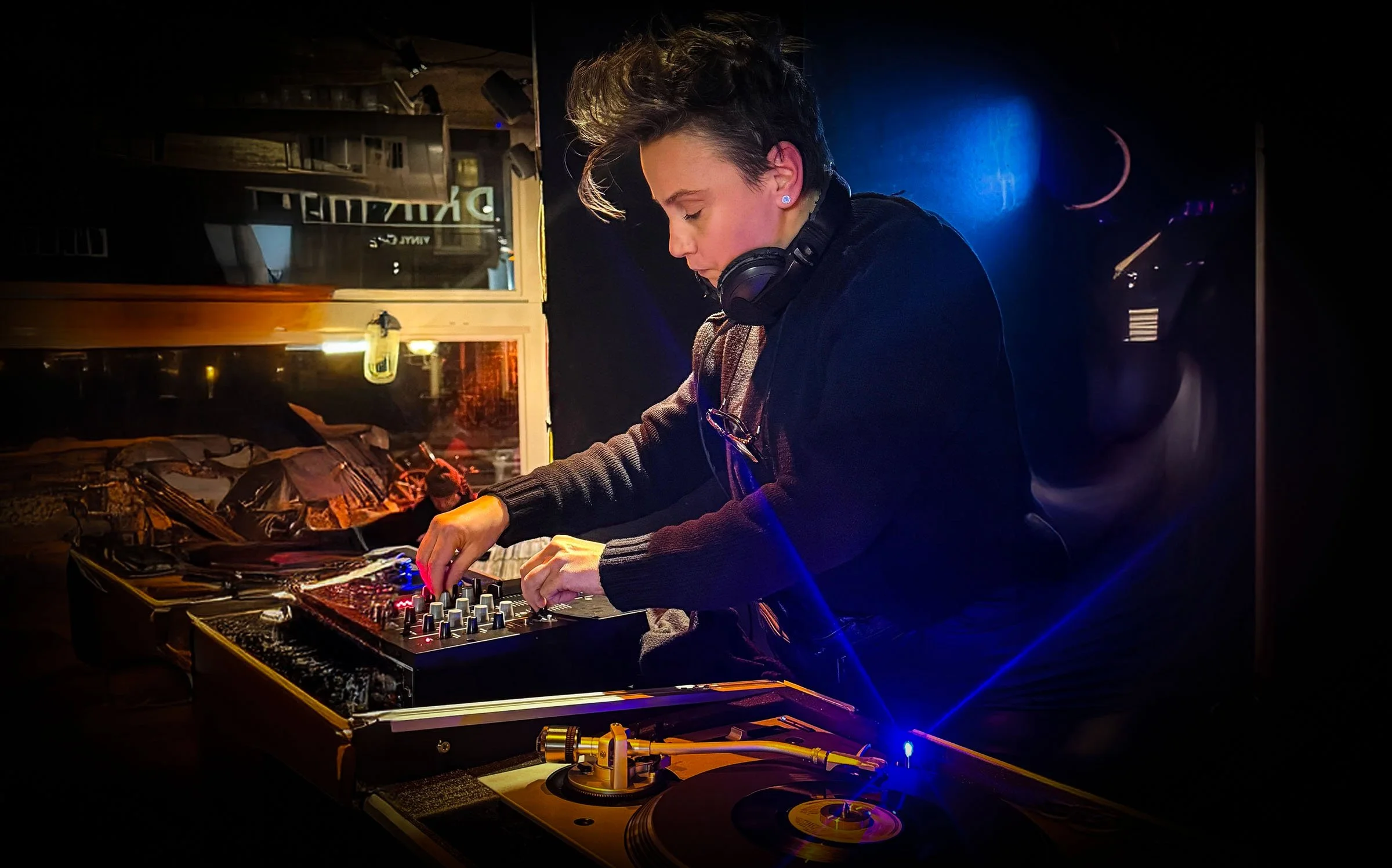 Nympho at the turntables playing a guest DJ set at Amsterdam Vinyl Club, a live music community event.