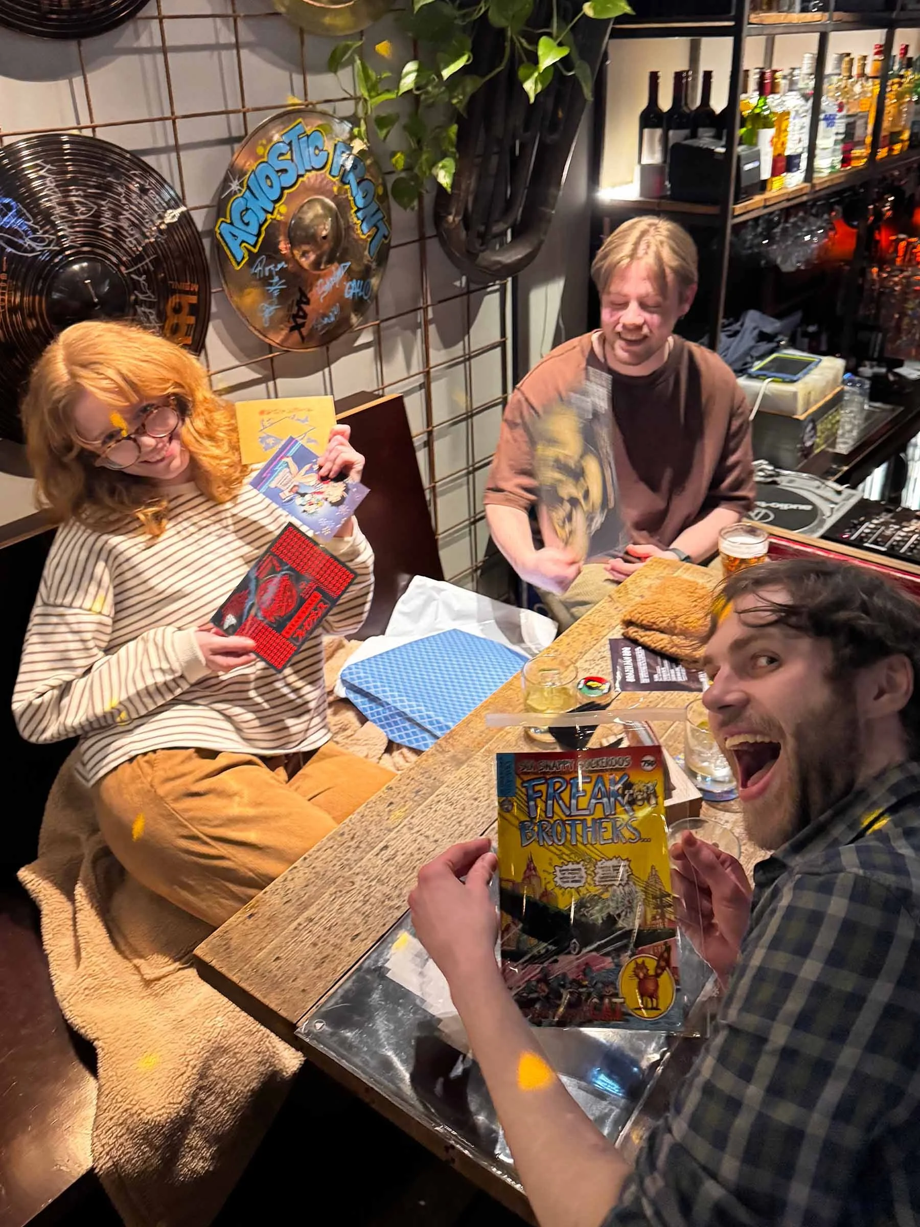 Quiz winners receive their prize bags after winning the quiz at an Amsterdam Vinyl Club live event.