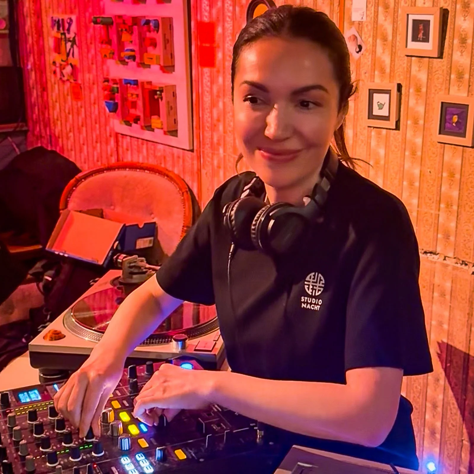 Sophia Sigma at the turntables playing a guest DJ set at Amsterdam Vinyl Club, a live music community event.