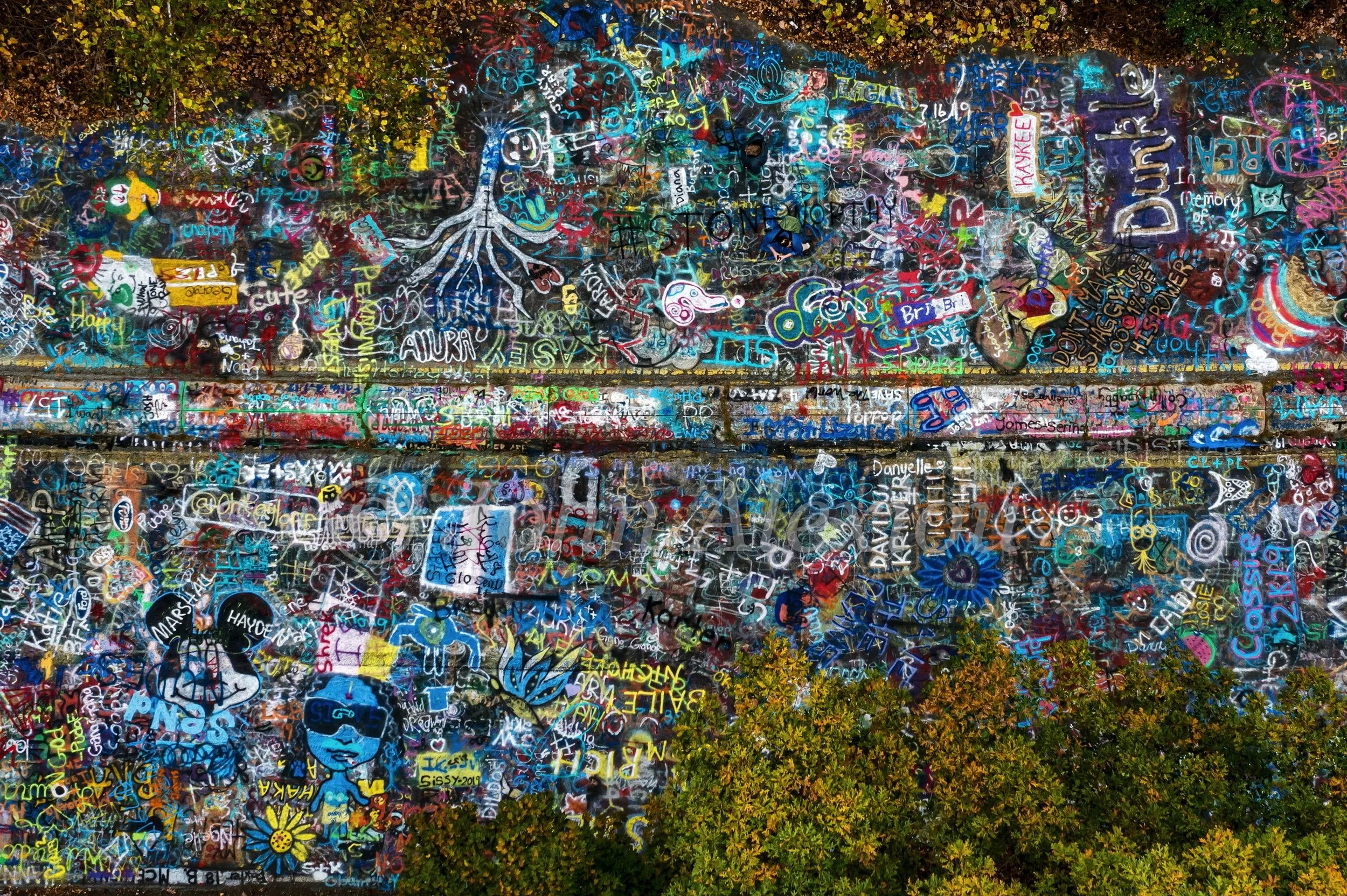 06 · Thousands of Gestures: A close aerial study of layered words, drawings and color on Graffiti Highway, Centralia, Pennsylvania, 2019.

© John Alexiou · 2019 · Centralia