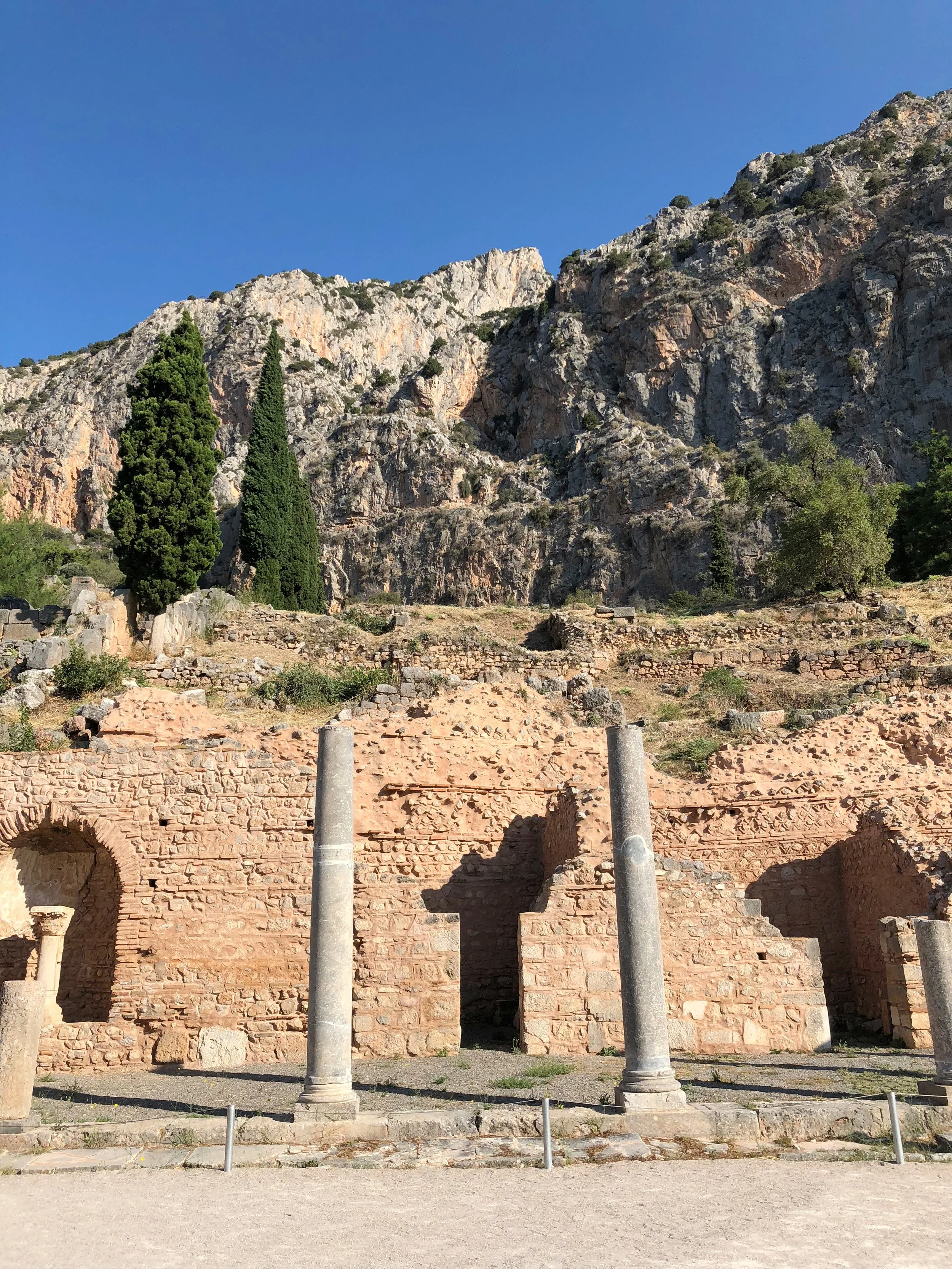 09 · Built Beneath the Cliff
Two columns stand before warm masonry below a rugged cliff.
2018 · Greece
iPhone X · 4.0 mm · f/1.8 · 1/1715 s · ISO 20