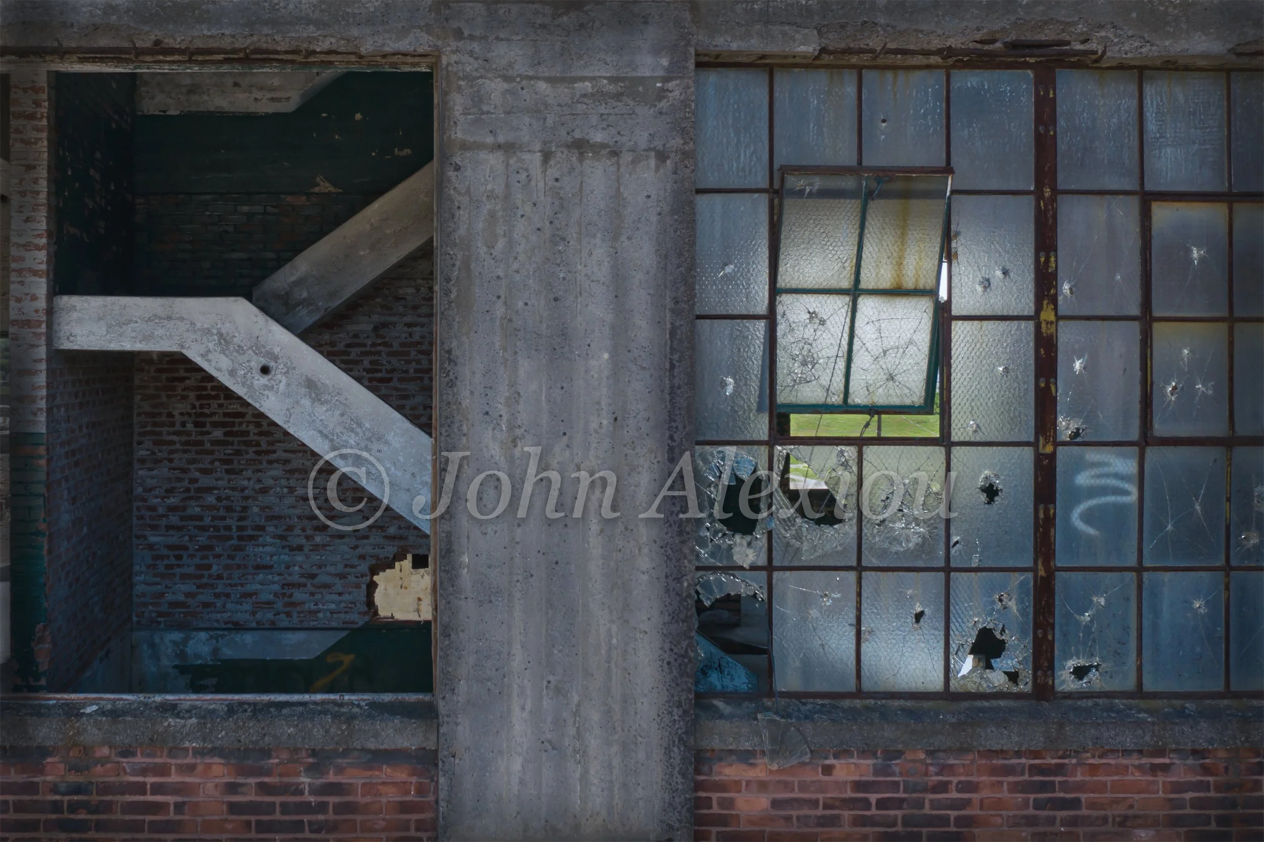 08 · What the Glass Reveals
Broken panes and an open bay reveal the factory's diagonal concrete bracing.
© John Alexiou · 2019 · Scranton Lace Company