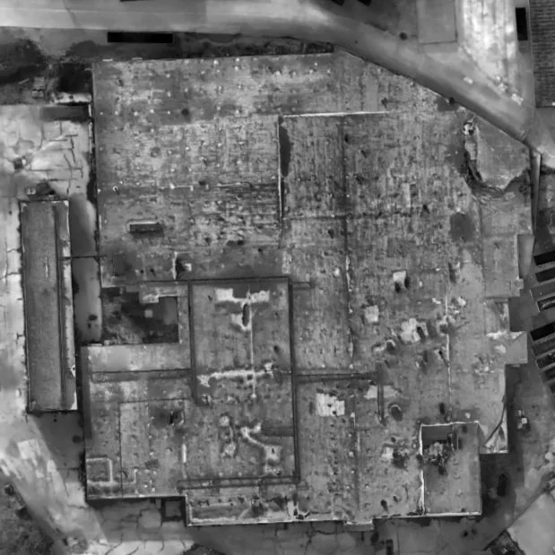 Thermal aerial view of a commercial warehouse roof showing temperature patterns