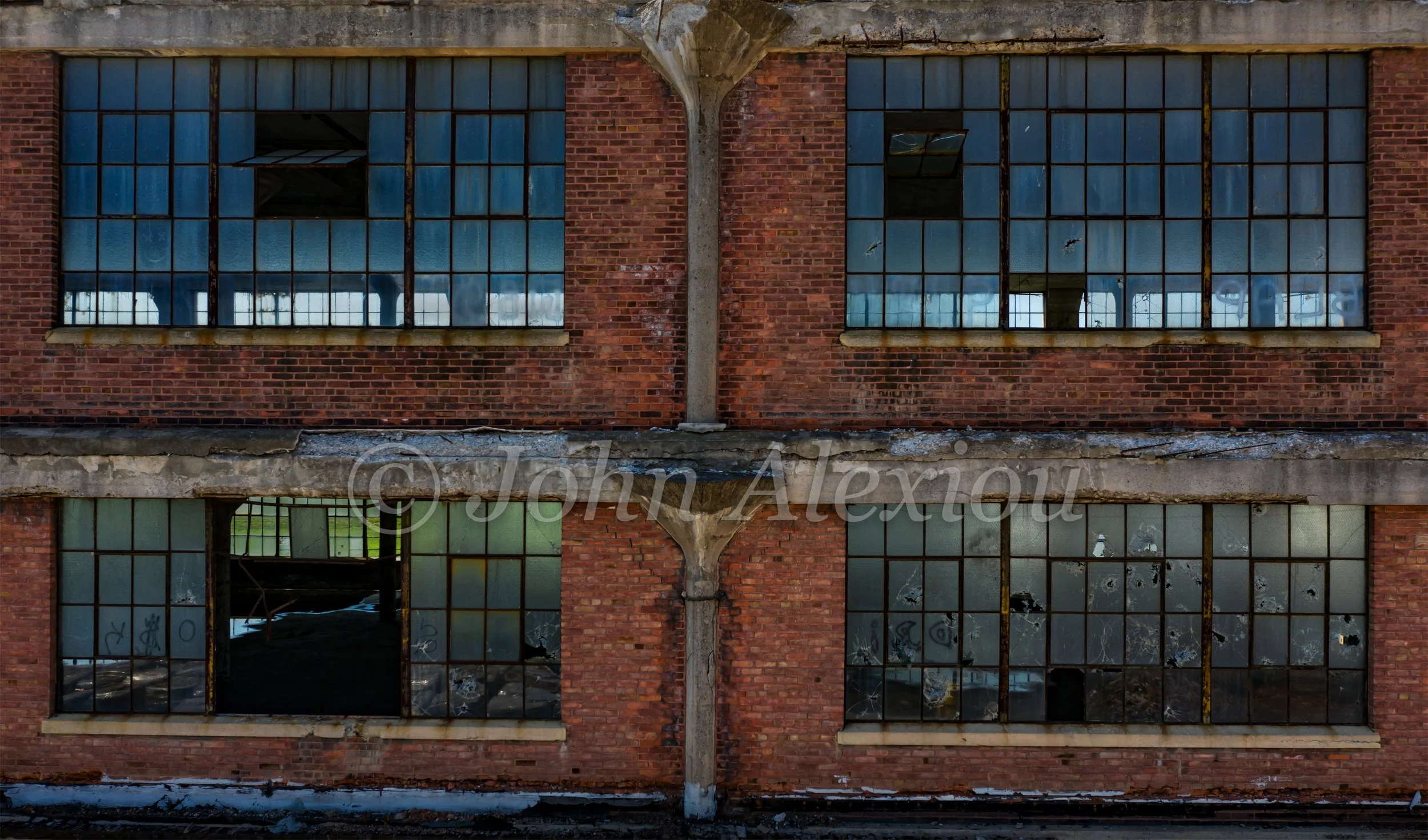 02 · Two Floors of Light
Rows of blue-green windows repeat across two floors of the red-brick factory.
© John Alexiou · 2019 · Scranton Lace Company