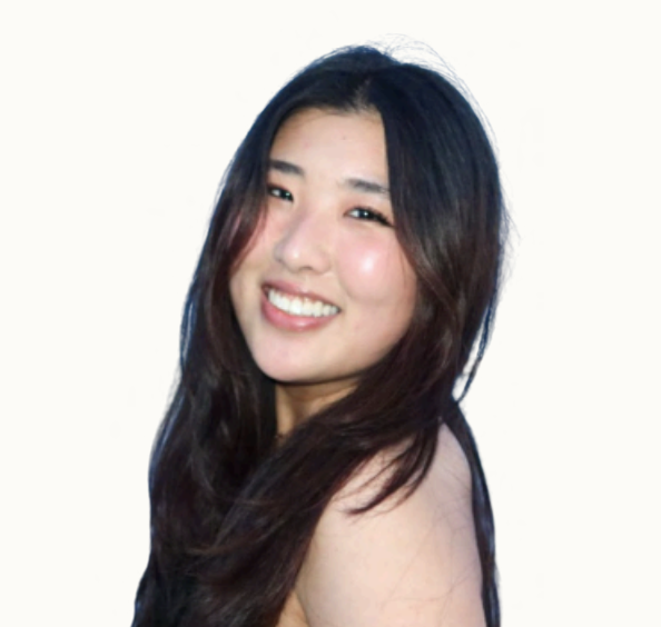 A young woman with long dark hair smiling against a white background.