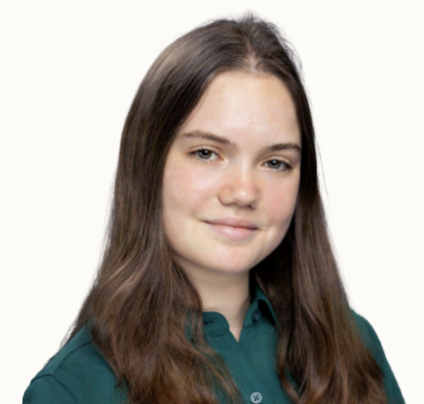 Portrait of a young woman with long brown hair wearing a dark green collared shirt, smiling softly against a plain white background.