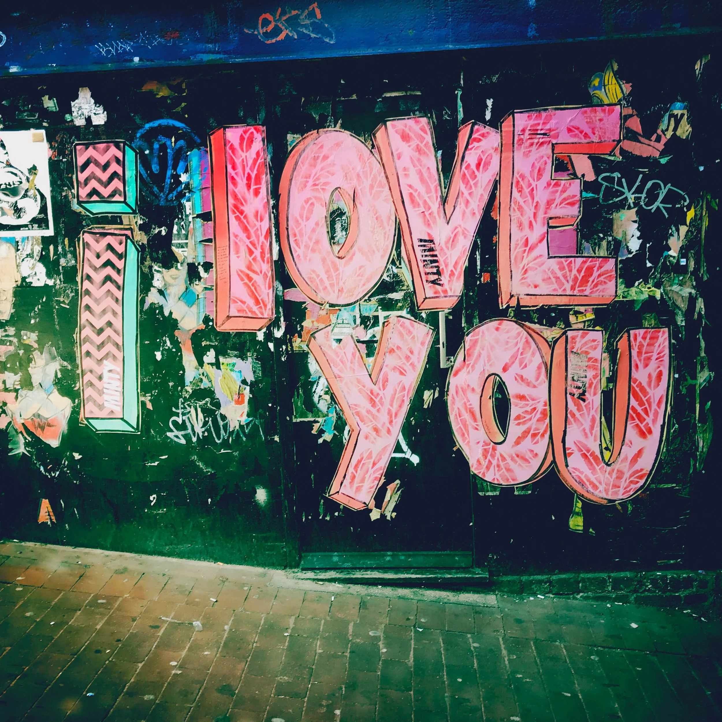 Street art in Brighton I Love You, Pink on Black.