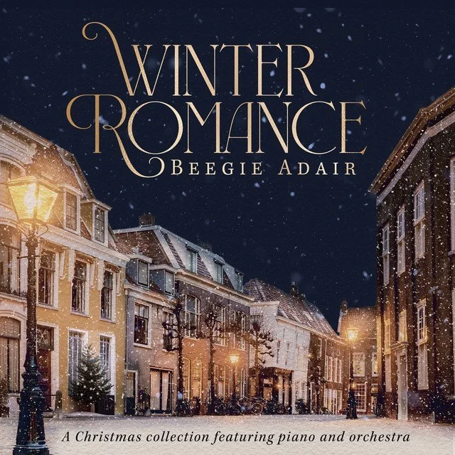 Cover art for Beegie Adair's piano jazz Christmas album Winter Romance. The cover has a night time snow covered village on it.