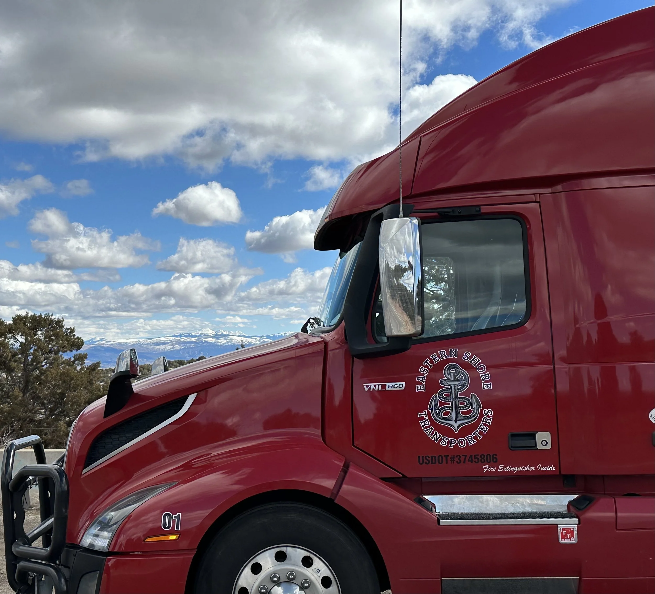 Well maintained and clean, DOT compliant, Red Volvo Semi truck / tractor.