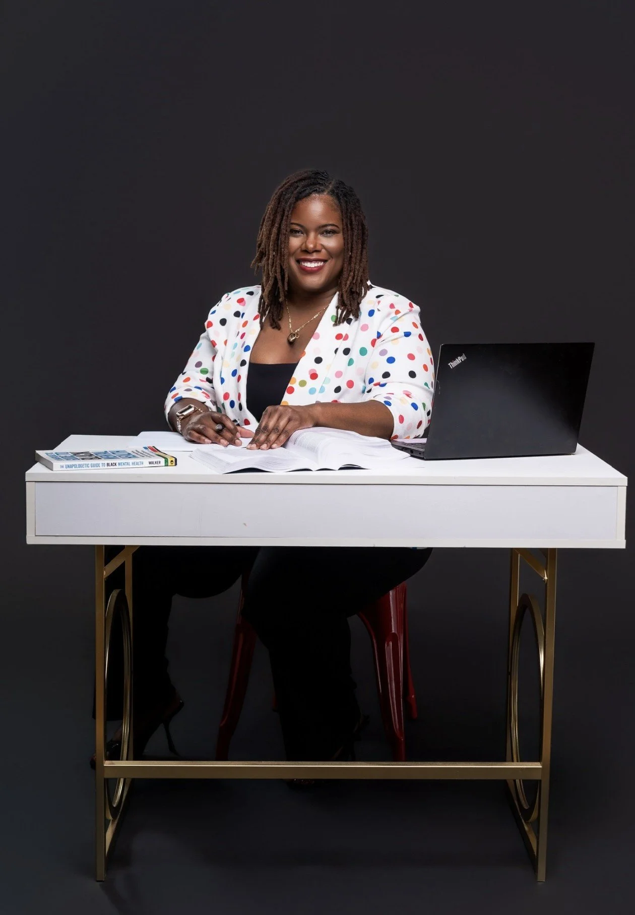 Shanti Robinson LCSW providing virtual grief therapy and consulting services at her desk.