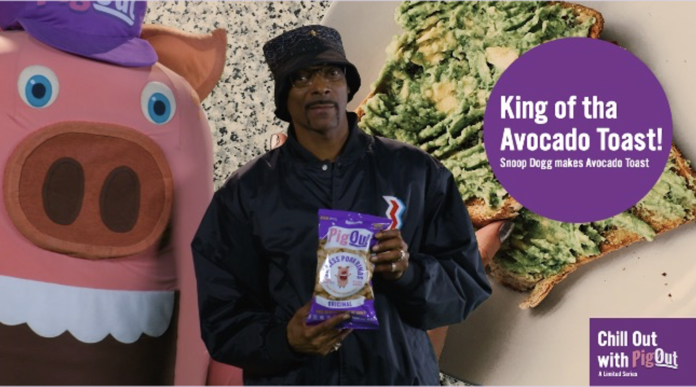 A man in a black jacket and black hat holding a bag of Pig Out snack chips standing next to a large pink pig-shaped inflatable with blue eyes. Behind them is a large slice of avocado toast with mashed avocados on toasted bread. The image contains a p