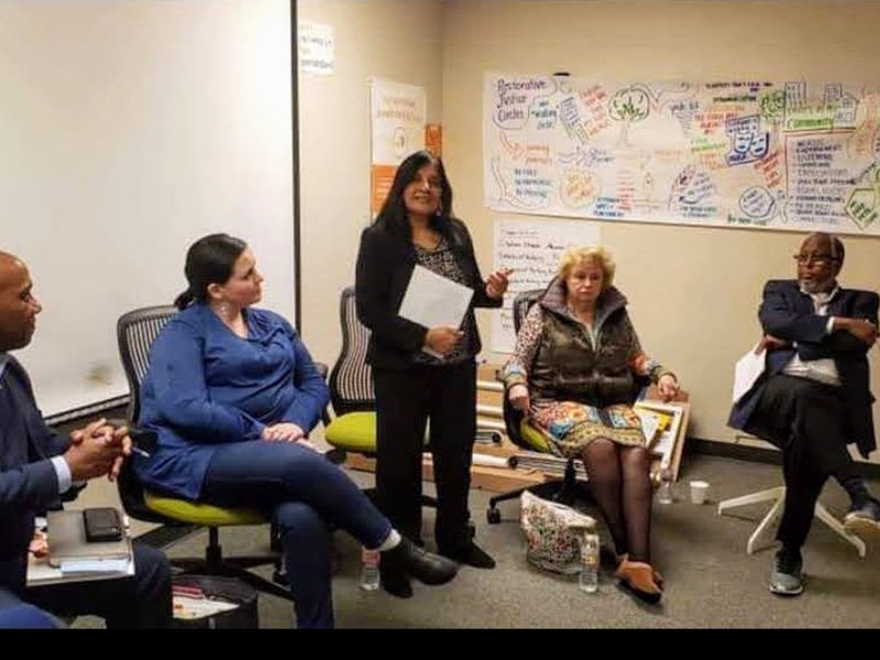 Maya leading a community forum