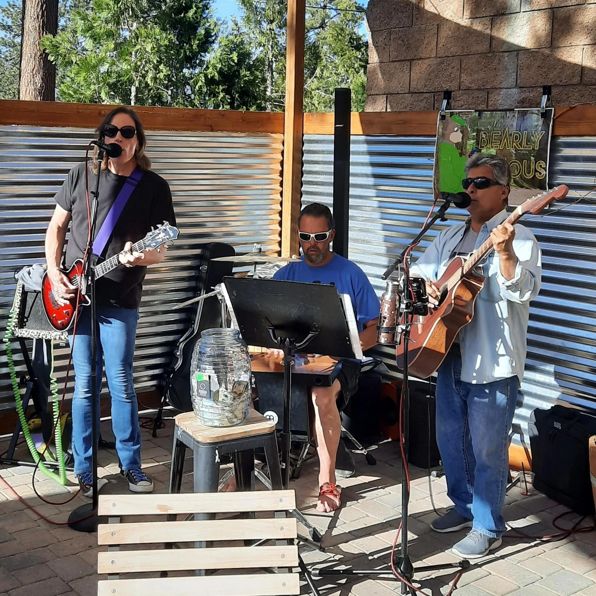 3 man band playing on the patio