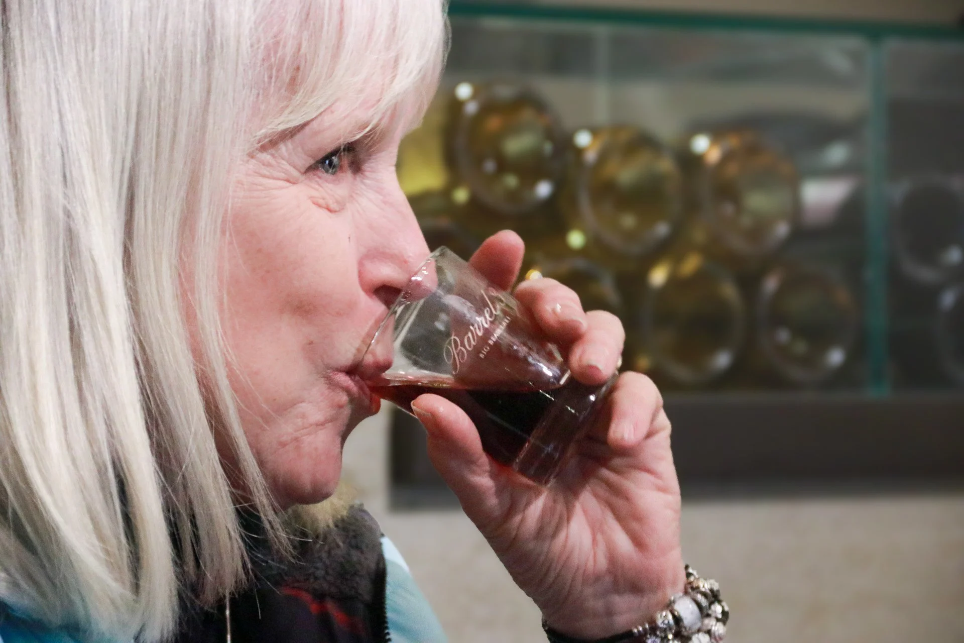 Woman sipping a wine sample