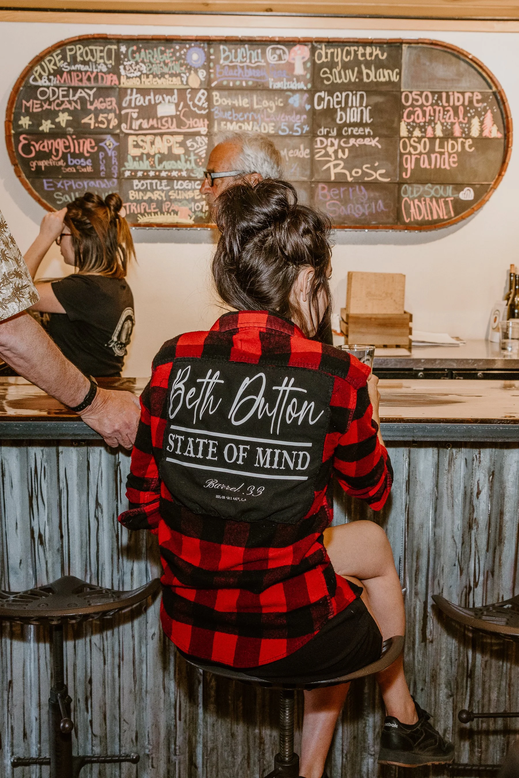 gal wearing a Bett Dutton state of mind flannel