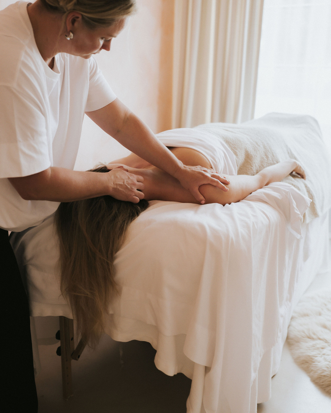 hands giving face sculpting massage at FaceUp STudio in Remuera