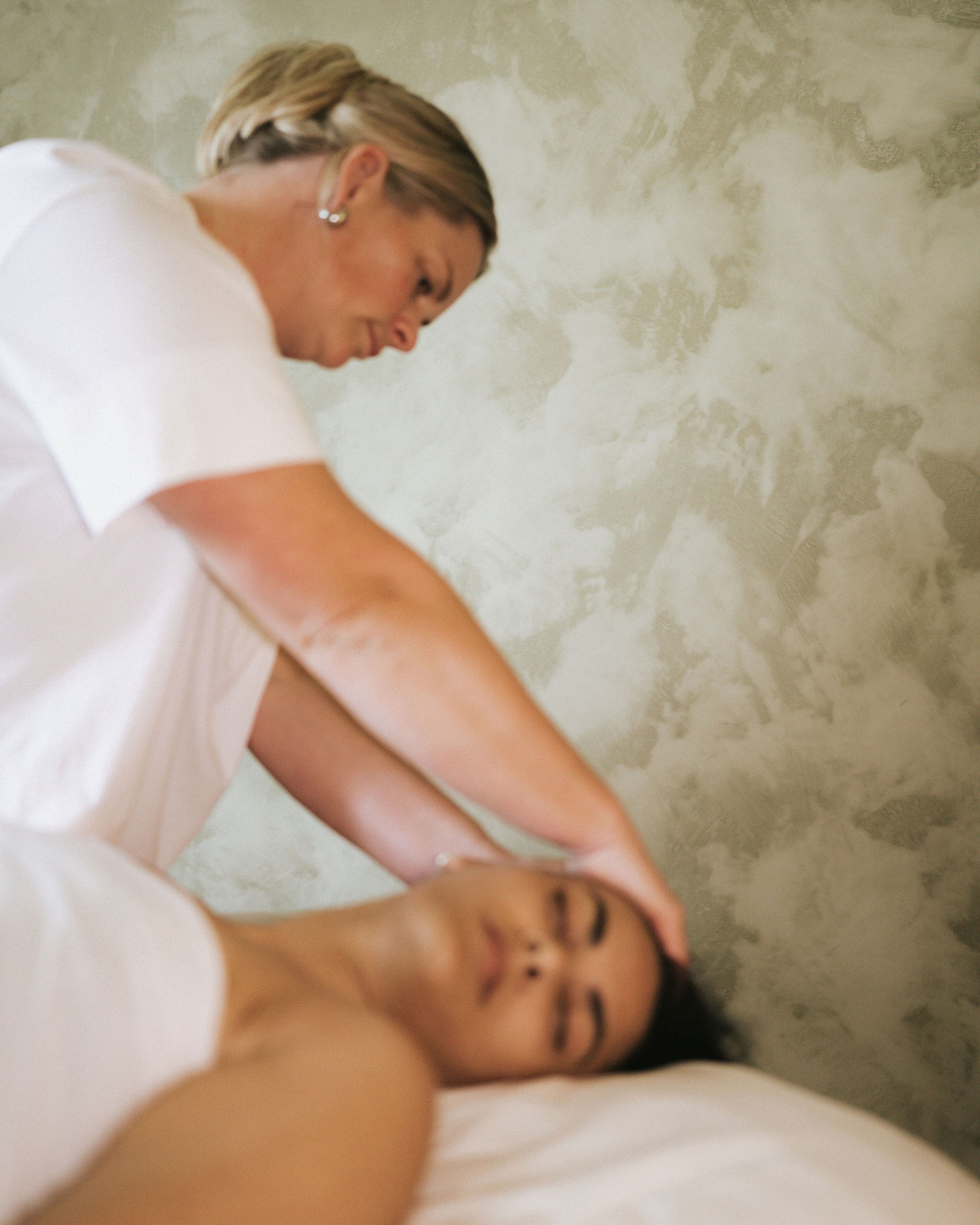 Client's calm, softened face after a FaceUp Studio facial massage session