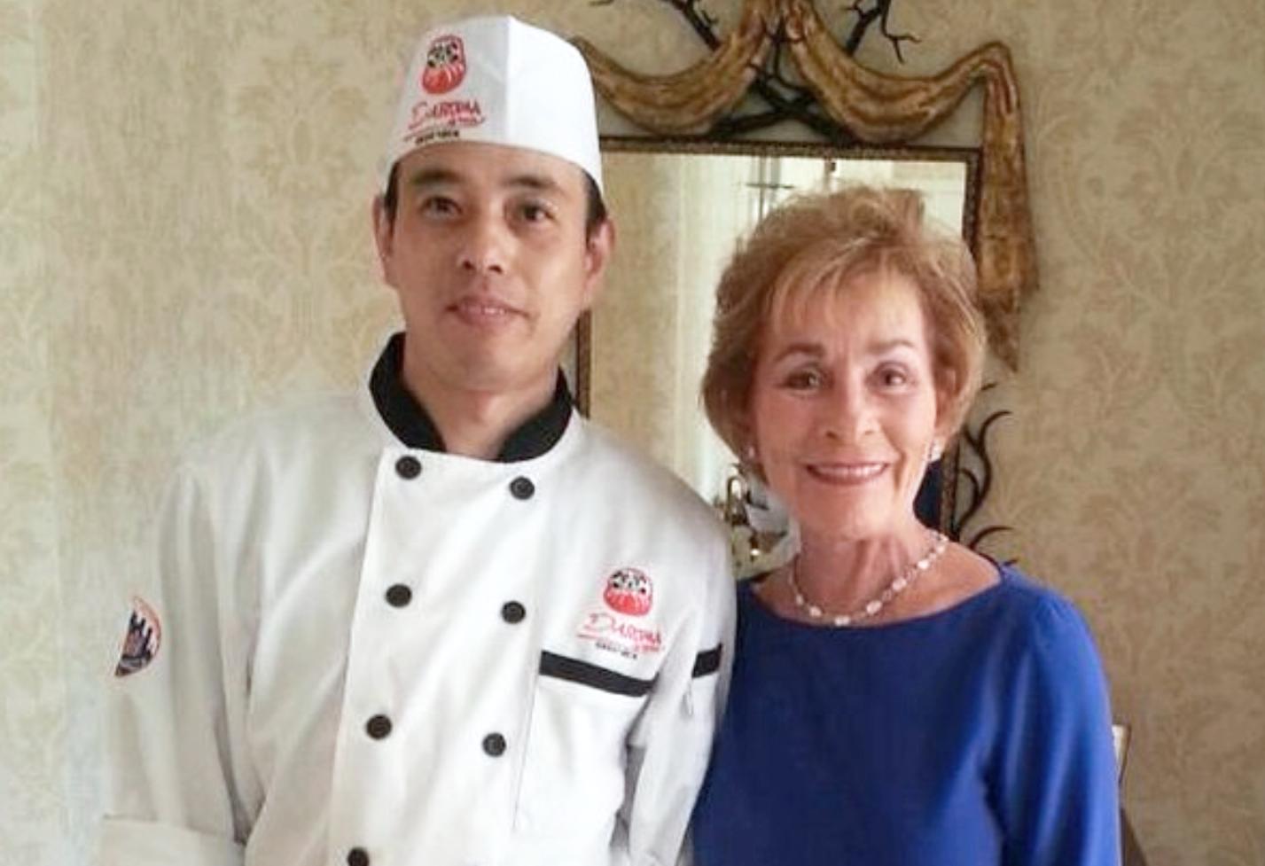 Executive chef Tom with Judge Judy, posing and smiling for a photo