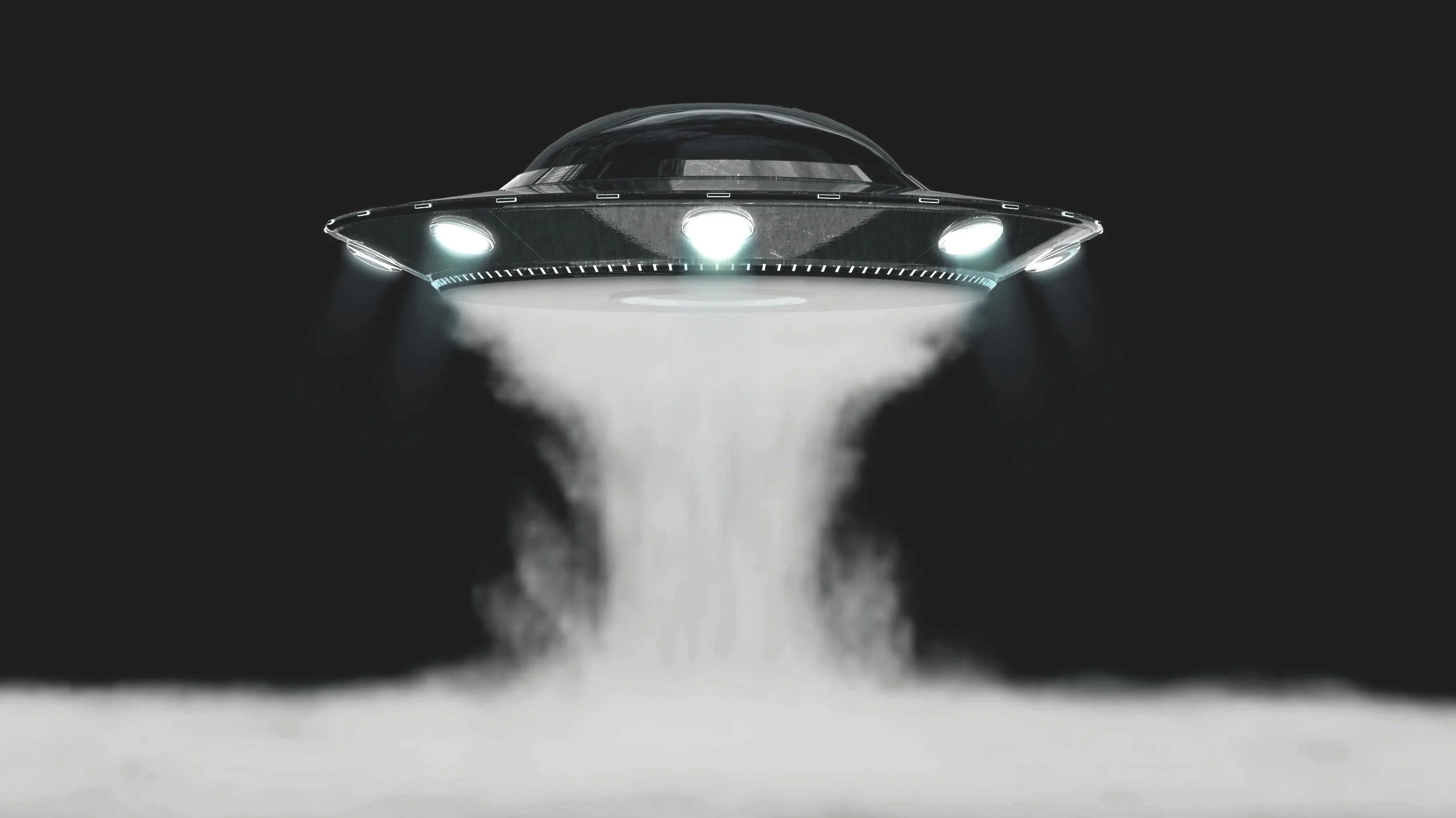 A flying saucer-shaped spaceship emitting a beam of white light downward.