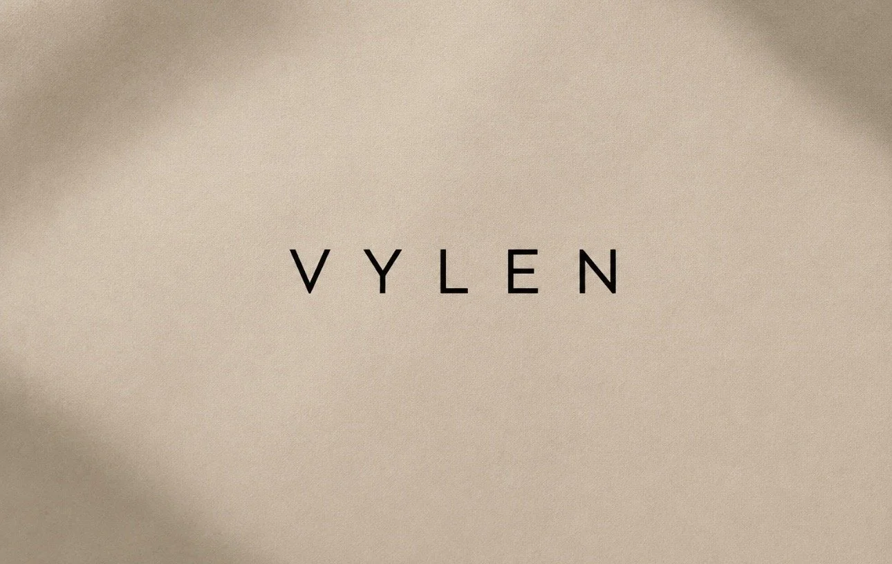 Text on a beige background that reads 'VYLEN' in black capital letters.
