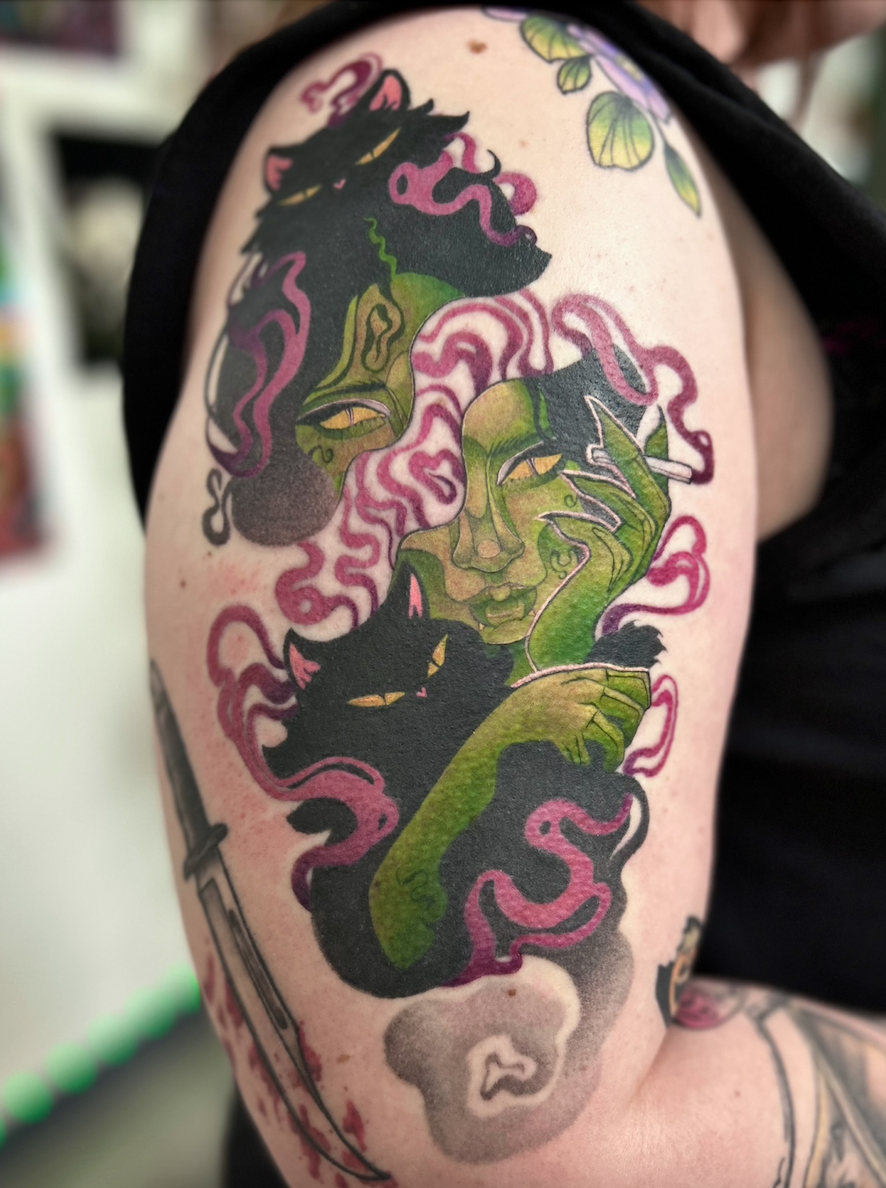 Cat woman tattoo by Arville Persons