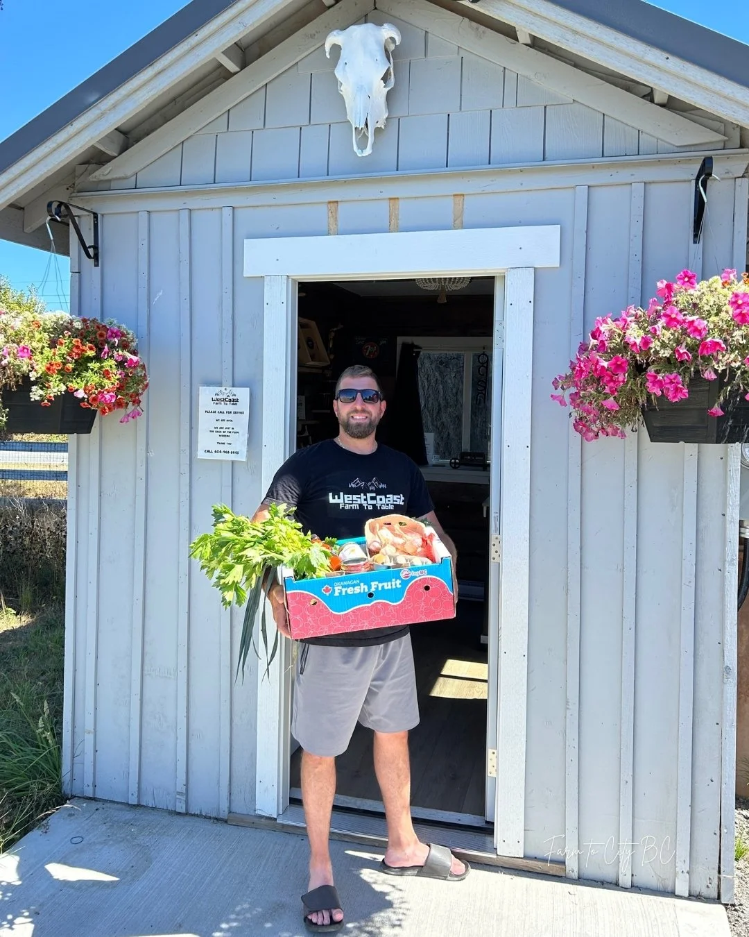 mike holding a custom farm box at west coast farm to table.jpg