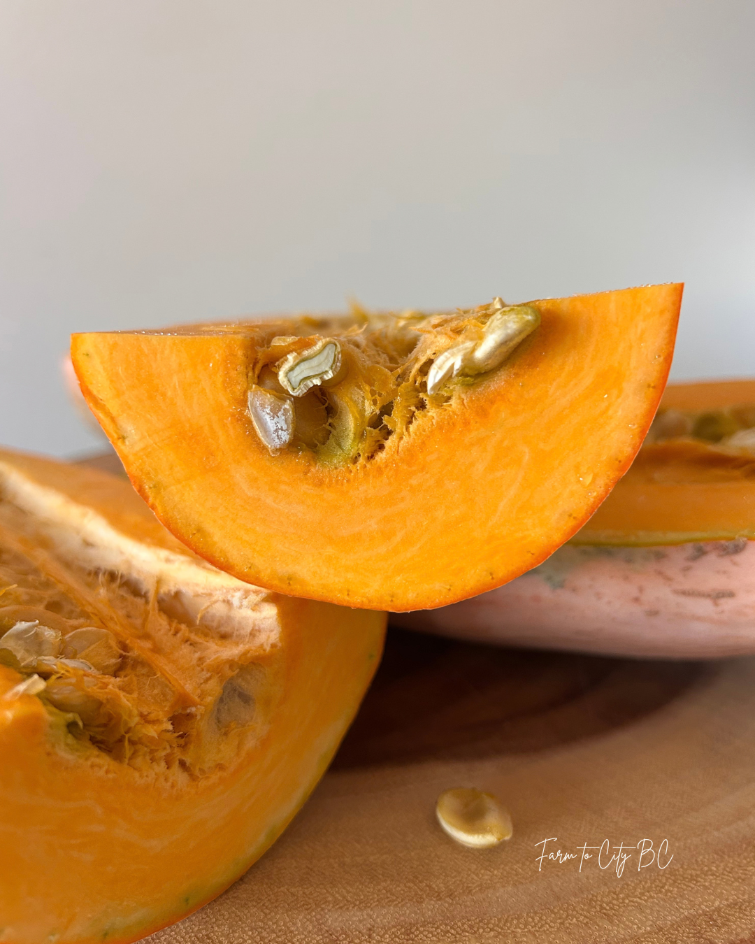 cross section of a pink banana pumpkin and pink banana pumpkin seeds.png